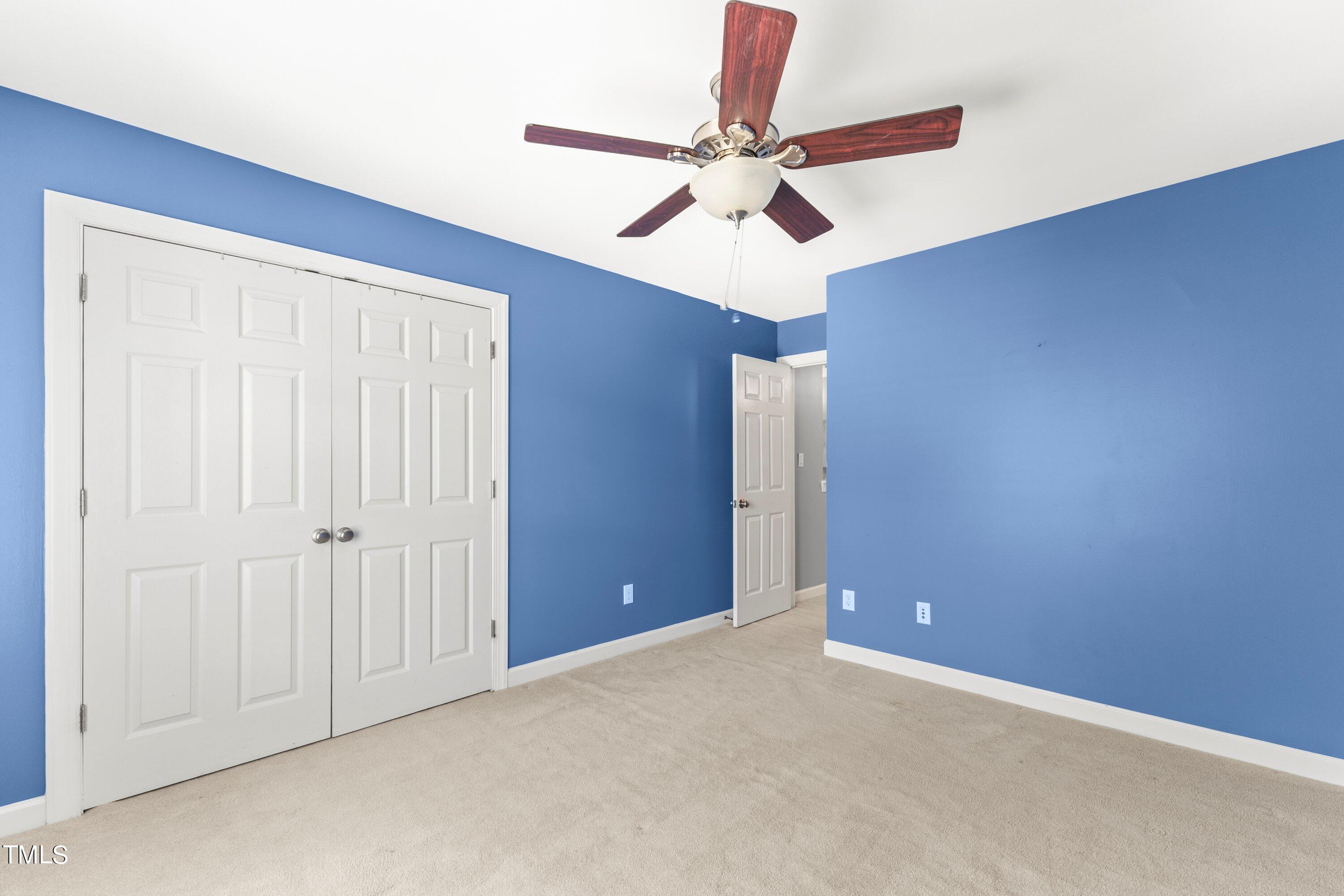 12212 Penrose Trail Raleigh, NC 27614 - Photo 26 of 41 an empty room with a fan and a fan