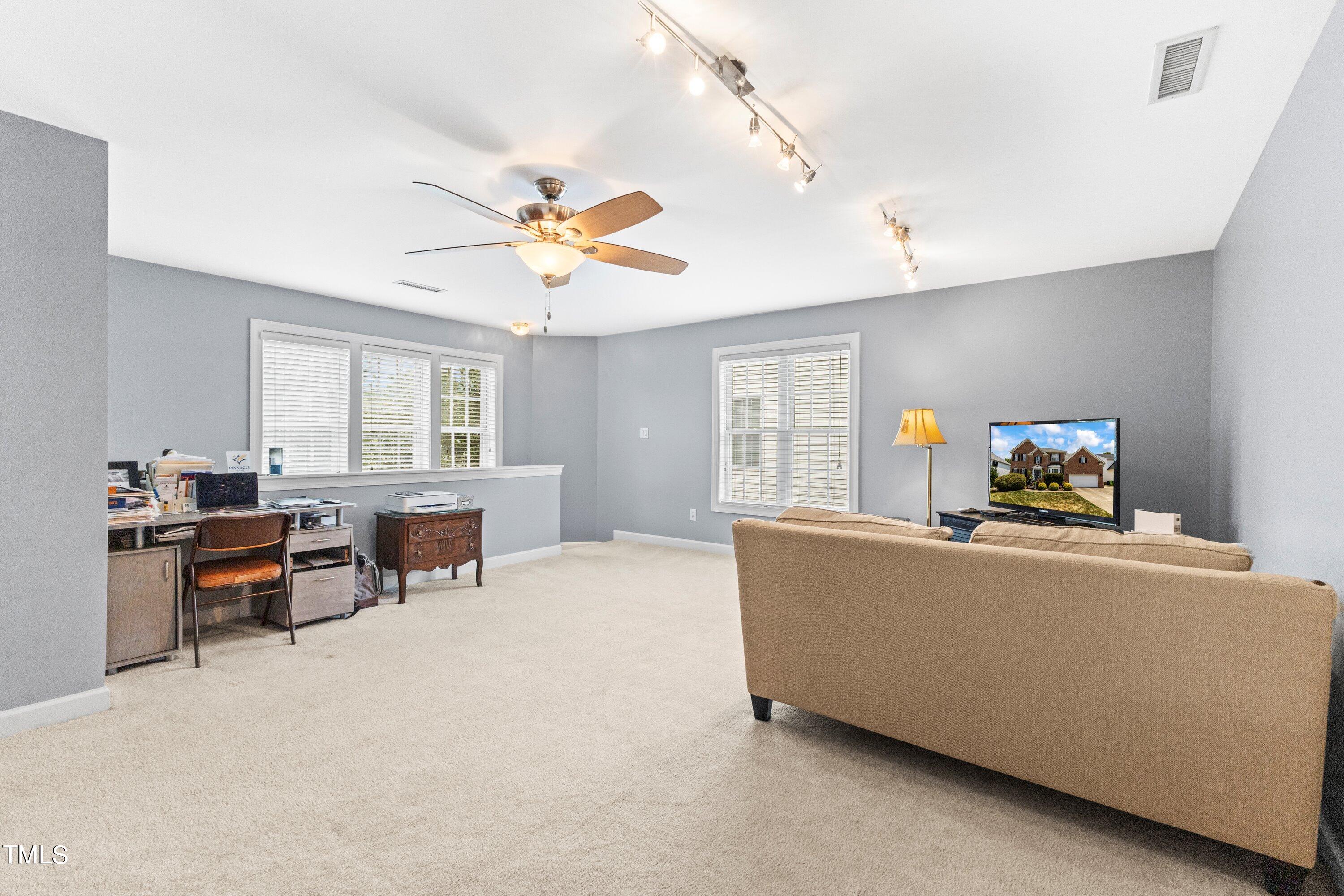 12212 Penrose Trail Raleigh, NC 27614 - Photo 30 of 41 a living room with furniture and a window