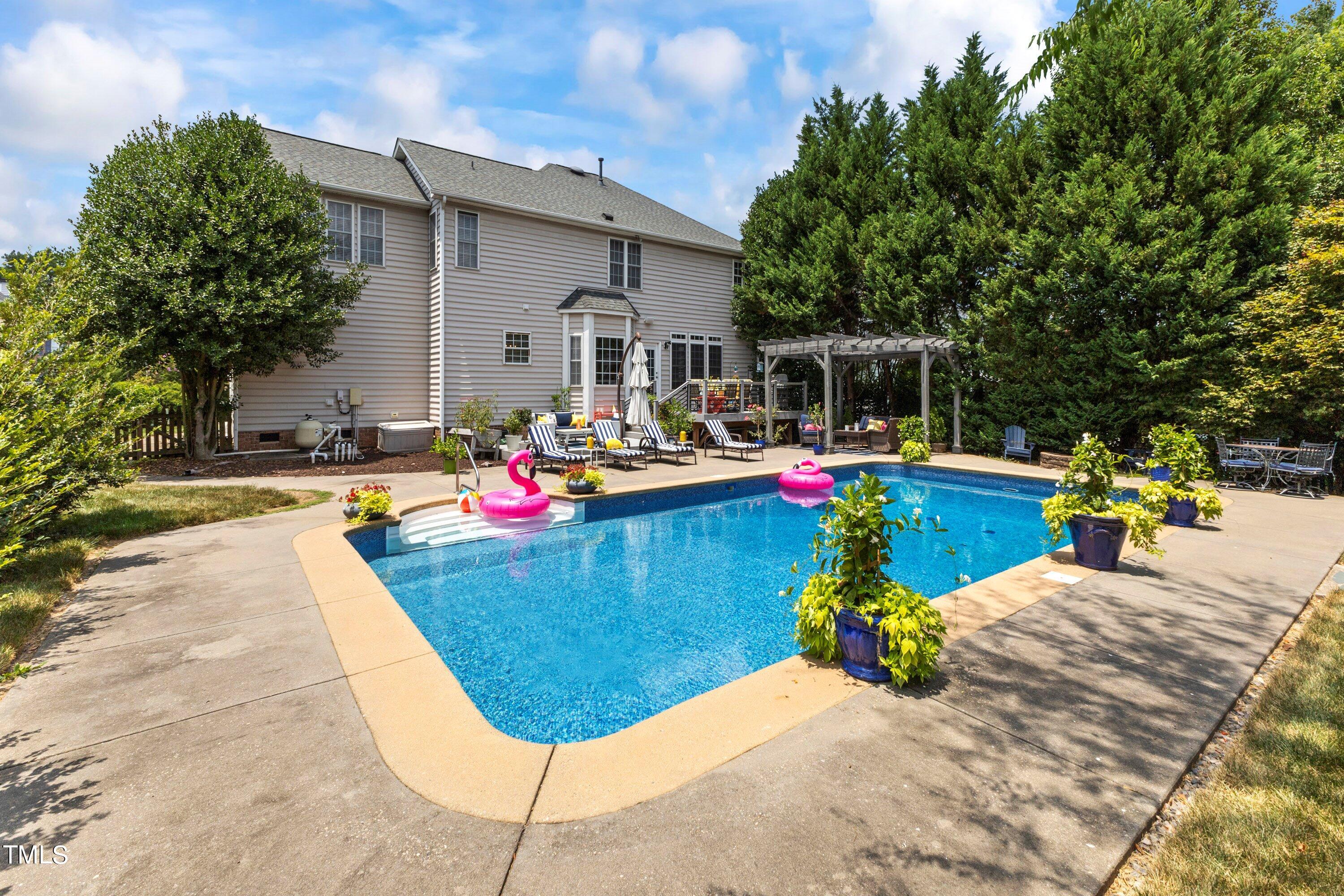 12212 Penrose Trail Raleigh, NC 27614 - Photo 3 of 41 a view of a swimming pool with a lounge chairs