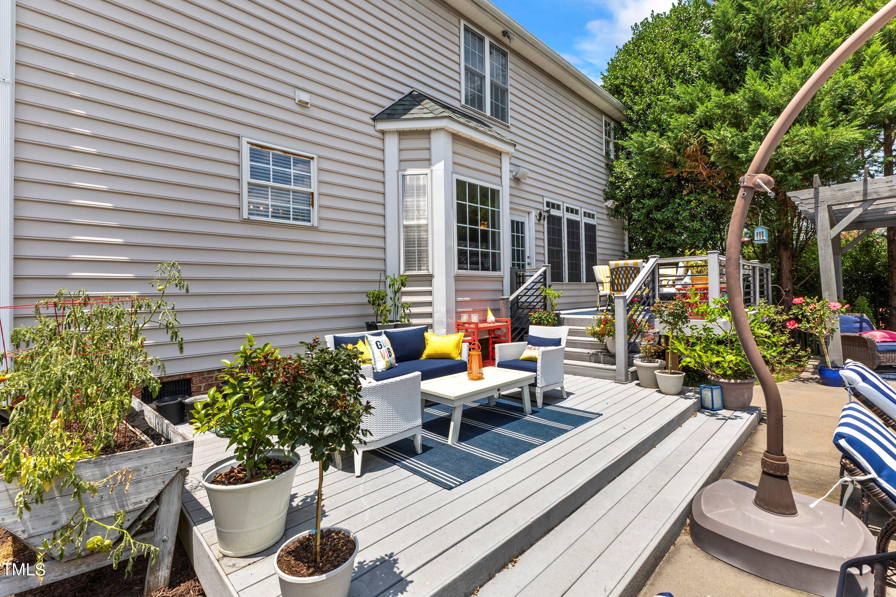 12212 Penrose Trail Raleigh, NC 27614 - Photo 32 of 41 a view of a chairs and table in a patio