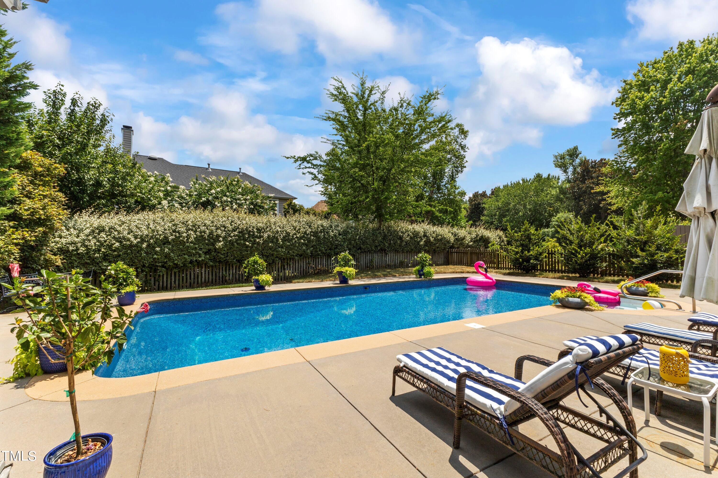 12212 Penrose Trail Raleigh, NC 27614 - Photo 35 of 41 a view of a patio with swimming pool