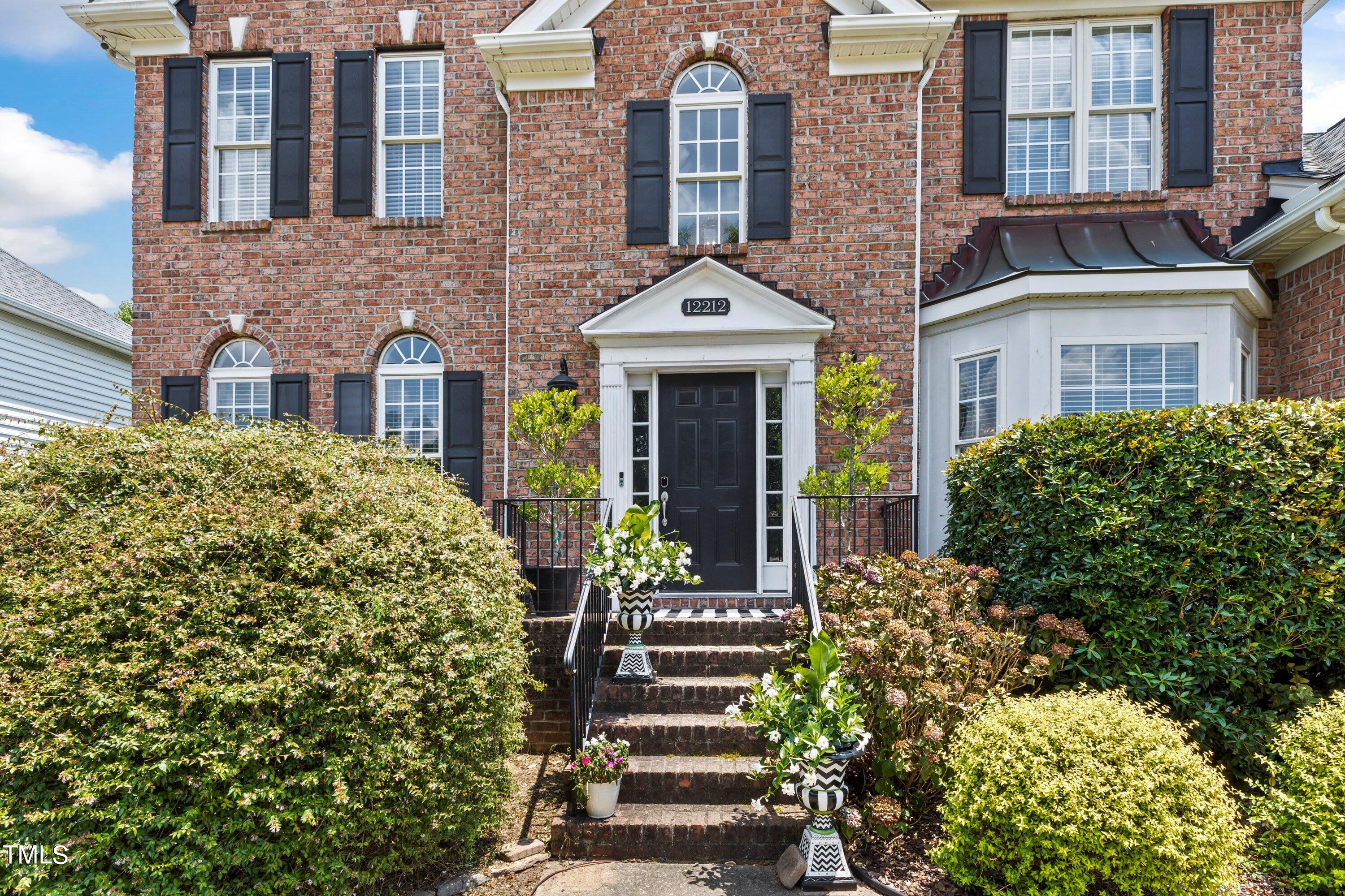 12212 Penrose Trail Raleigh, NC 27614 - Photo 4 of 41 a front view of a building