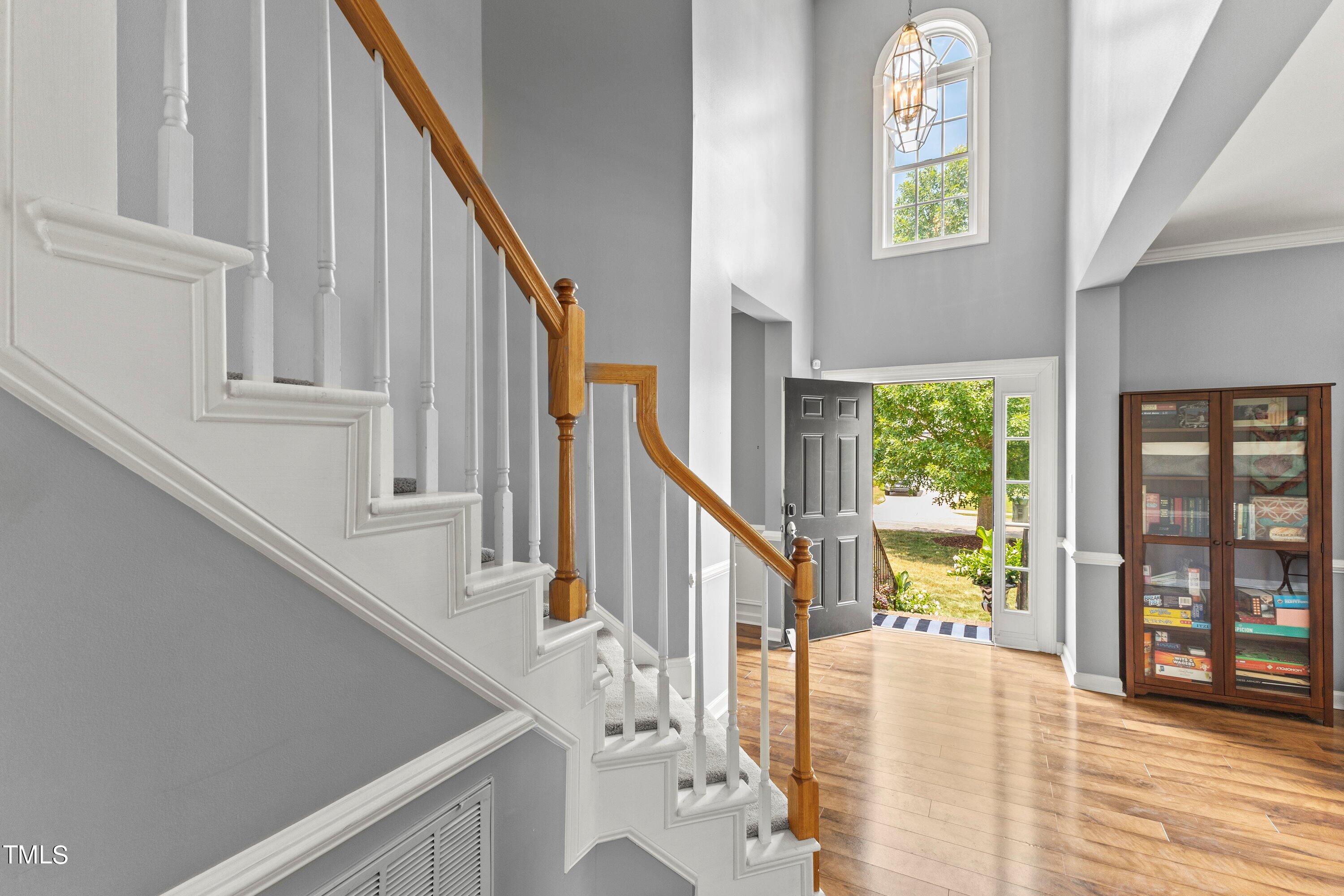 12212 Penrose Trail Raleigh, NC 27614 - Photo 5 of 41 a view of an entryway with wooden floor and windows