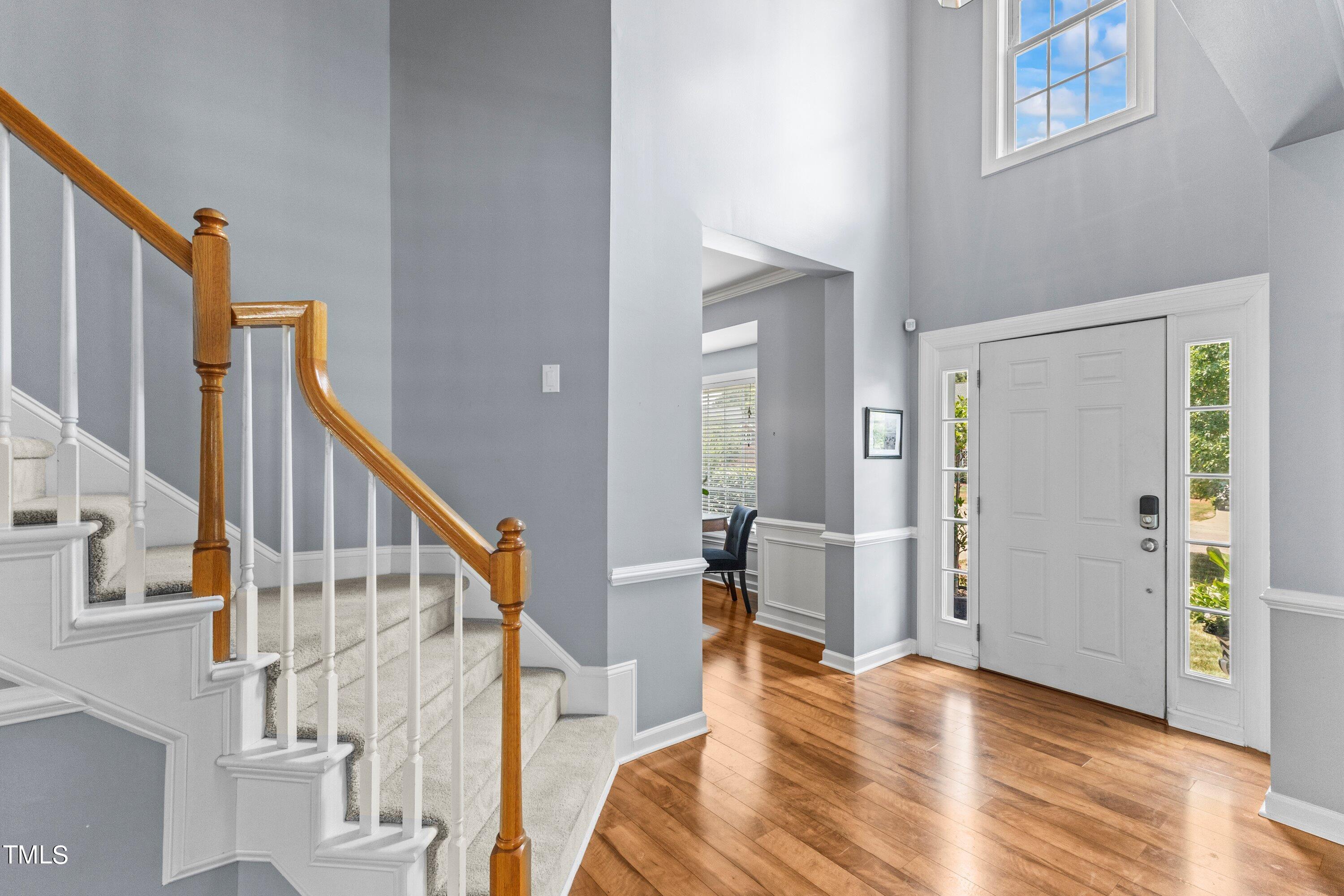12212 Penrose Trail Raleigh, NC 27614 - Photo 6 of 41 a view of entryway and hall with wooden floor