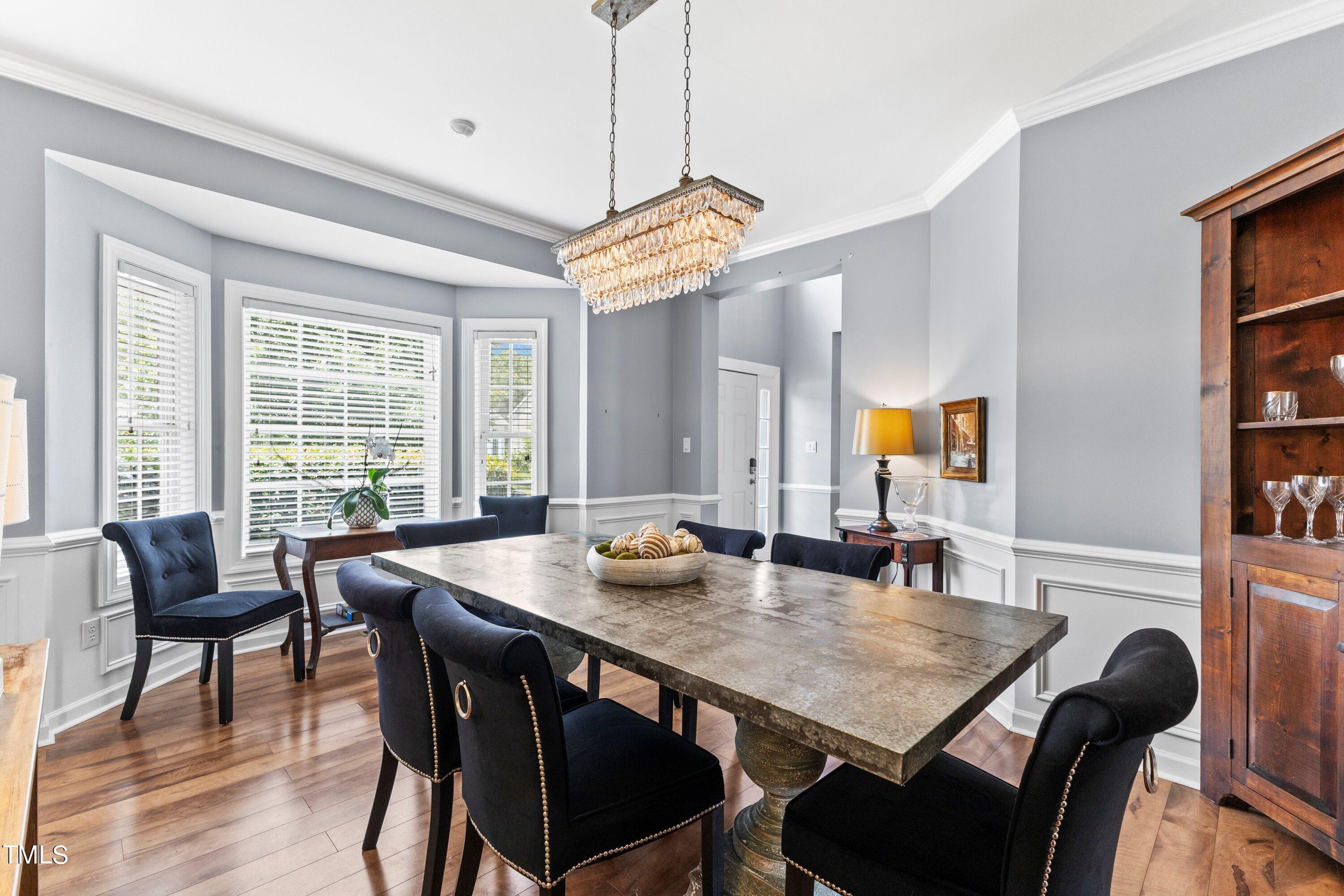 12212 Penrose Trail Raleigh, NC 27614 - Photo 10 of 41 a view of a dining room with furniture window and wooden floor