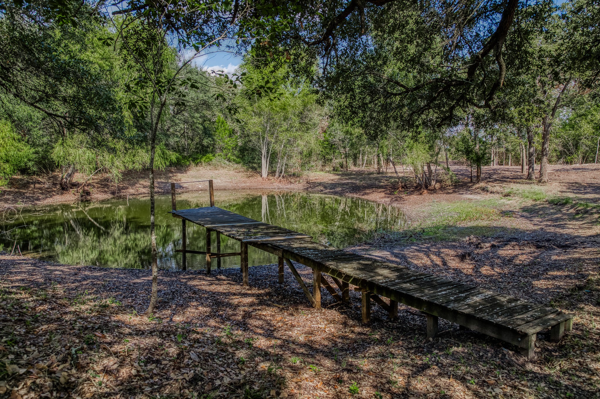 6 Sun Oil Road Brenham, TX 77833 - Photo 24 of 34 a view of a bench in a backyard