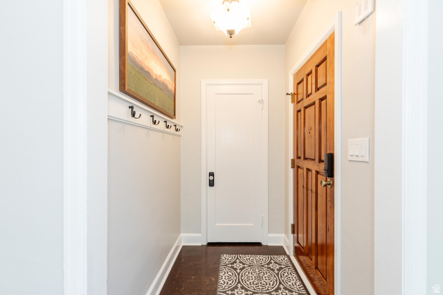 227 West 200 North Logan, UT 84321 - Photo 10 of 44 Entryway featuring rich wood-finish flooring and a paneled wood entry door