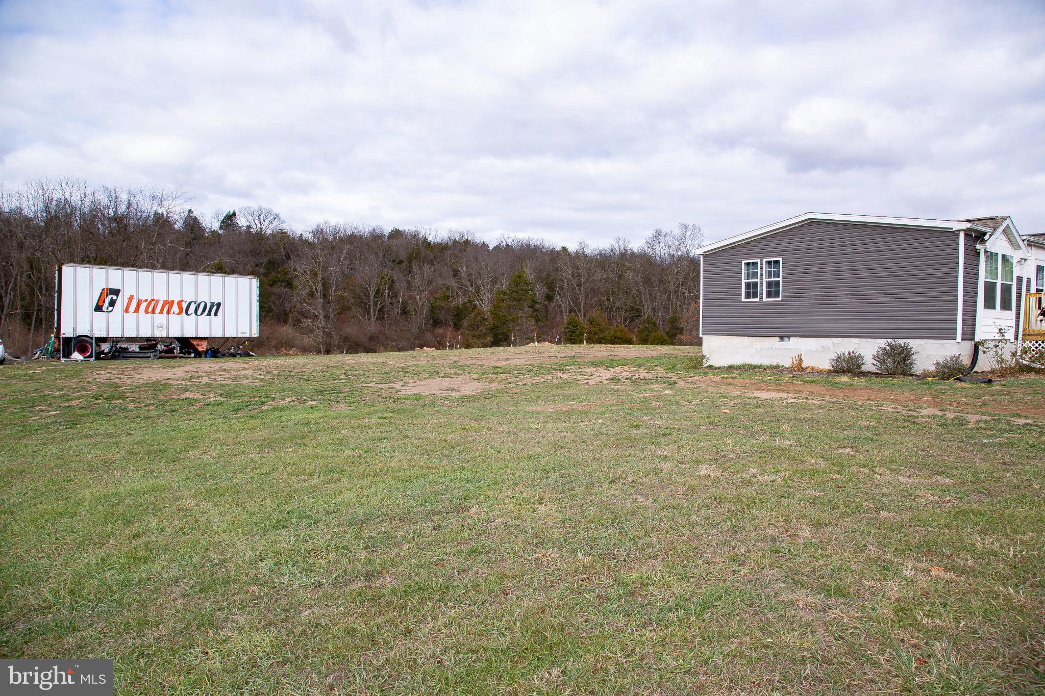 1101 Beaver Run Road Burlington, WV 26710 - Photo 30 of 40 a big yard with lots of tress in front of it