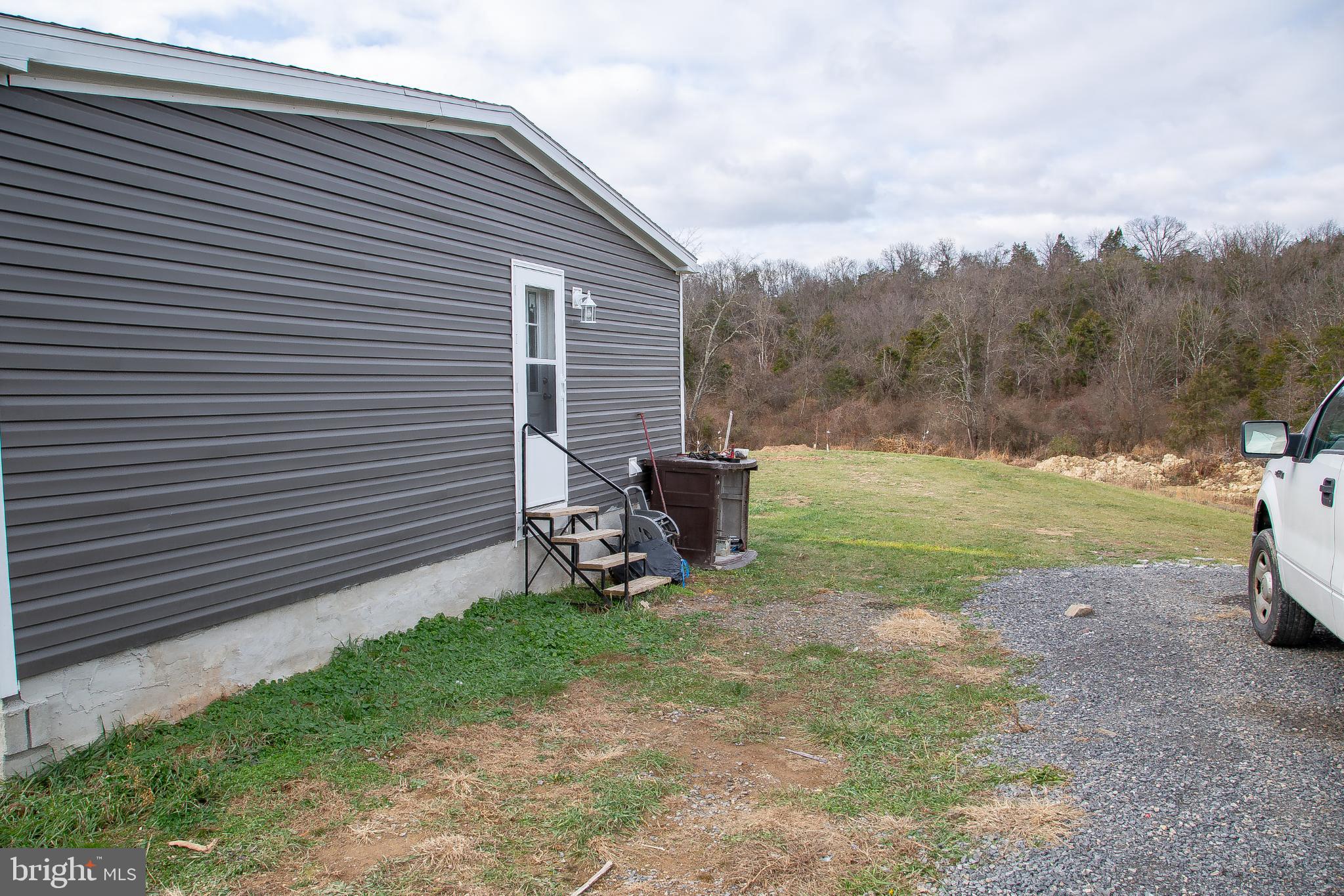 1101 Beaver Run Road Burlington, WV 26710 - Photo 34 of 40 a view of a backyard with sitting area
