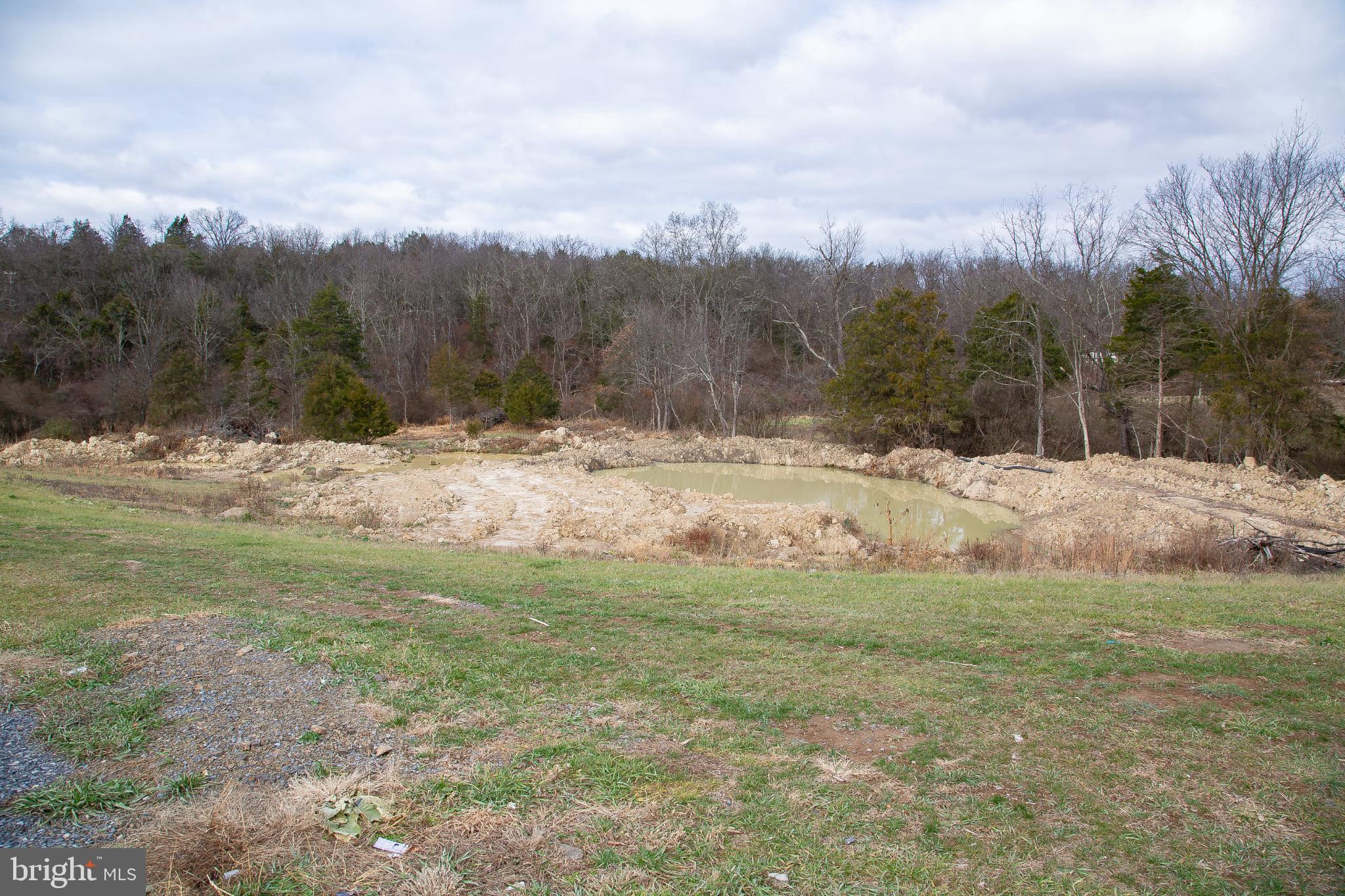 1101 Beaver Run Road Burlington, WV 26710 - Photo 40 of 40 a view of a dirt field with trees in the background