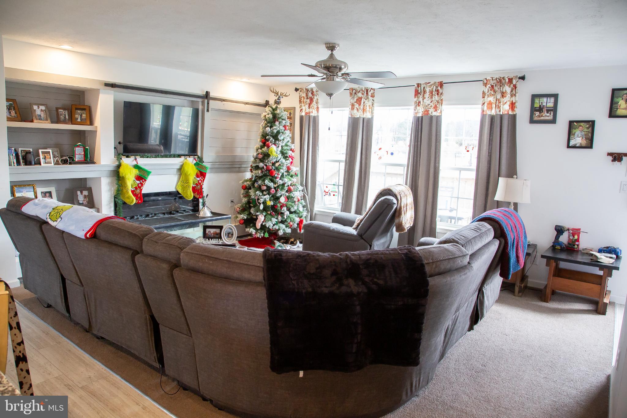 1101 Beaver Run Road Burlington, WV 26710 - Photo 7 of 40 a living room with furniture and a chandelier