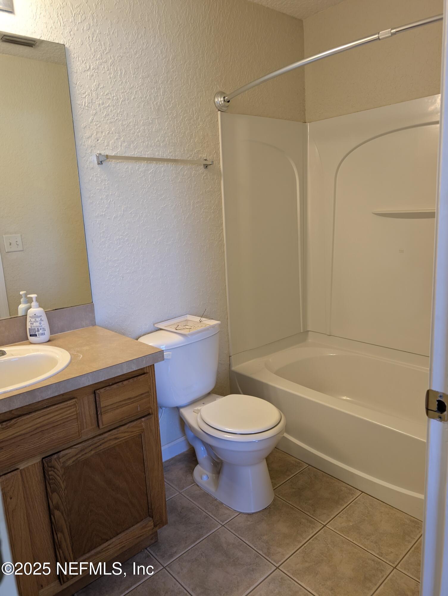 1811 Lago Del Sur Drive Middleburg, FL 32068 - Photo 10 of 10 a bathroom with a sink a toilet and a bathtub