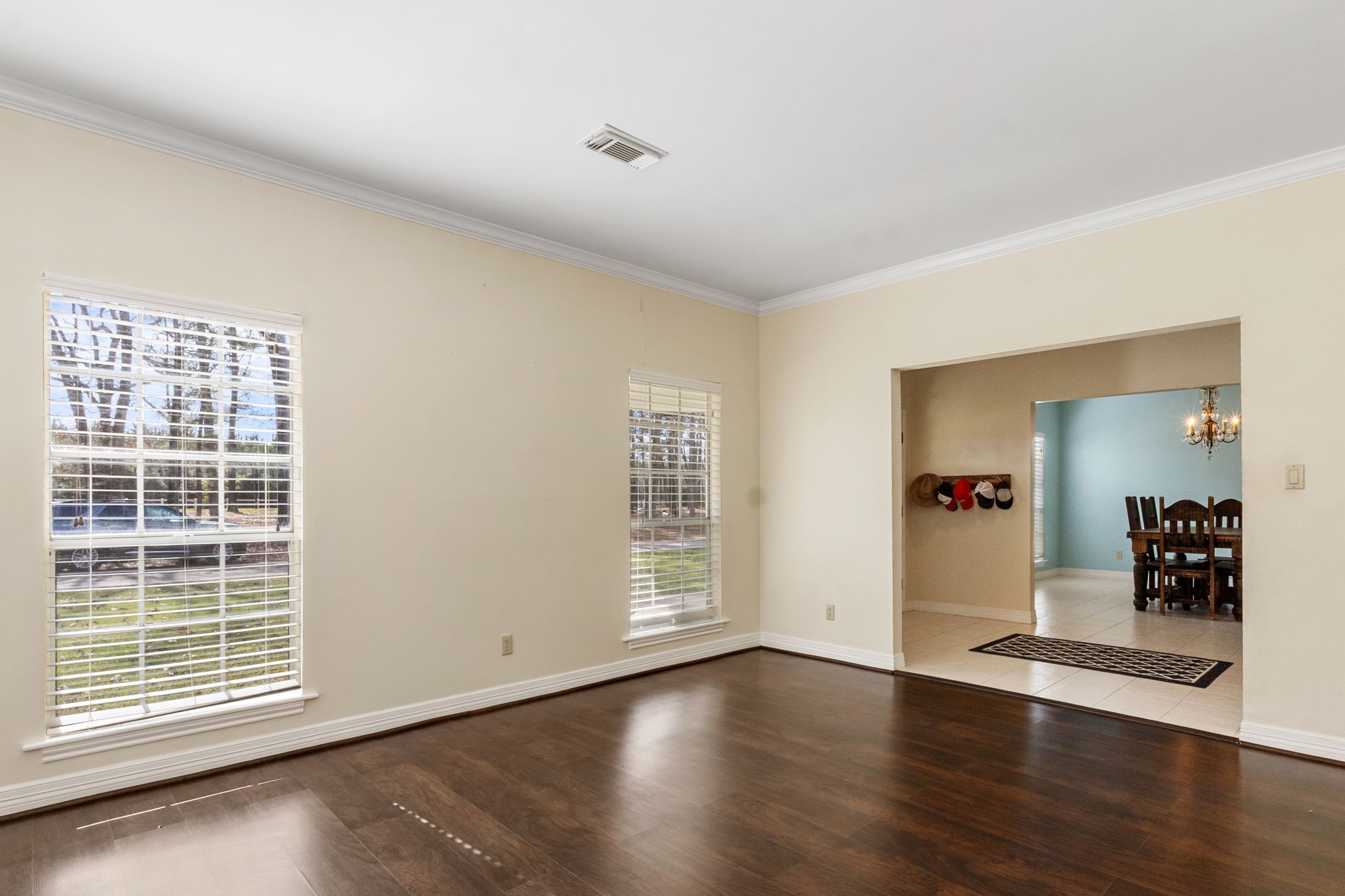 9139 Highway 94 Groveton, TX 75845 - Photo 15 of 49 a view of an empty room with wooden floor and a window
