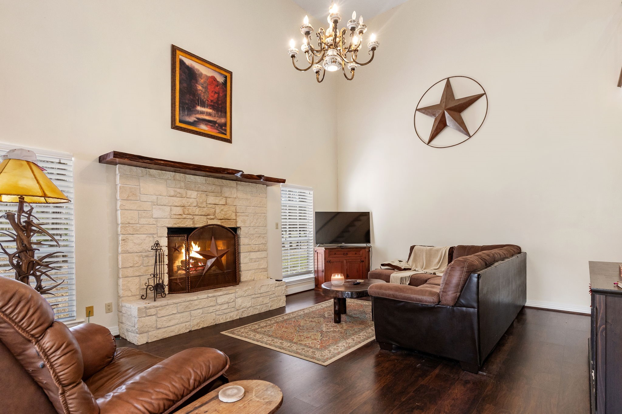 9139 Highway 94 Groveton, TX 75845 - Photo 19 of 49 a living room with furniture chandelier and a fireplace