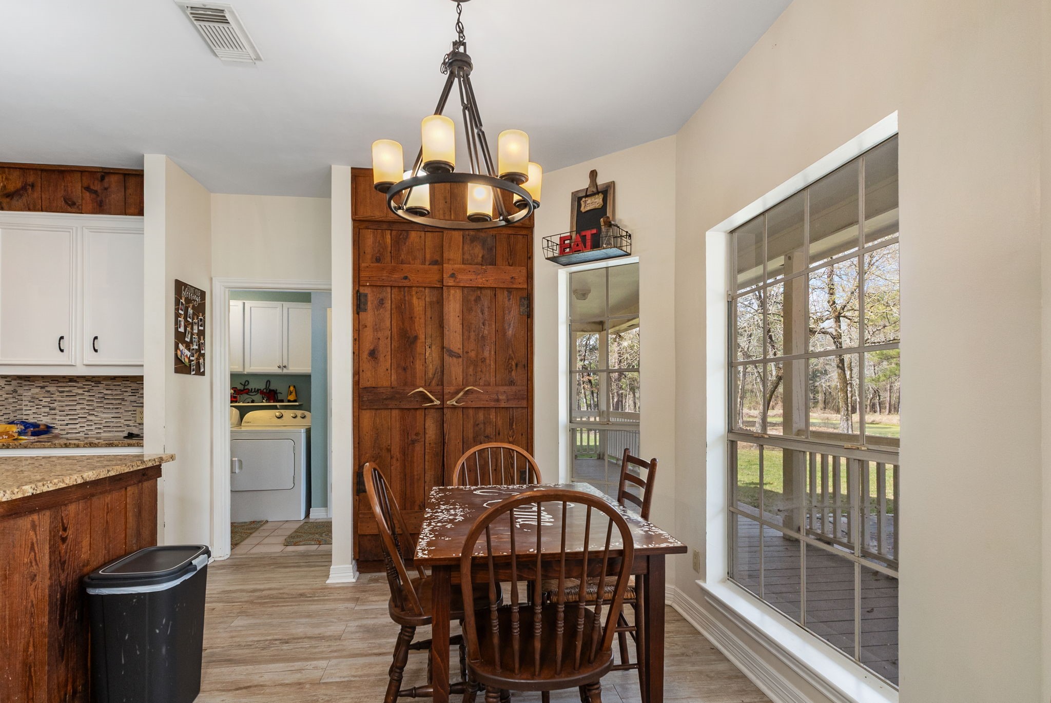 9139 Highway 94 Groveton, TX 75845 - Photo 21 of 49 a view of a dining room with furniture window and wooden floor