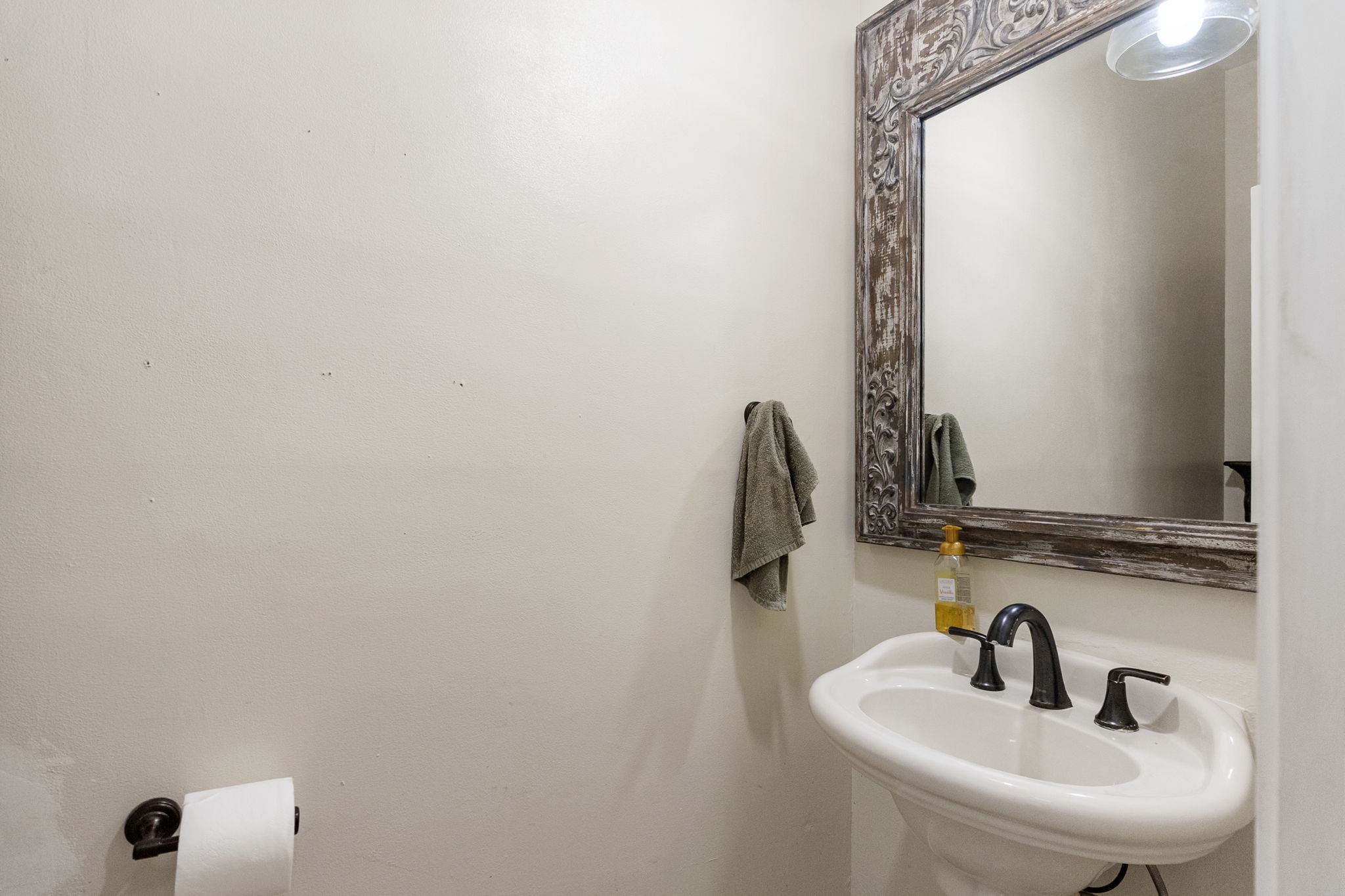 9139 Highway 94 Groveton, TX 75845 - Photo 26 of 49 a bathroom with a sink and mirror