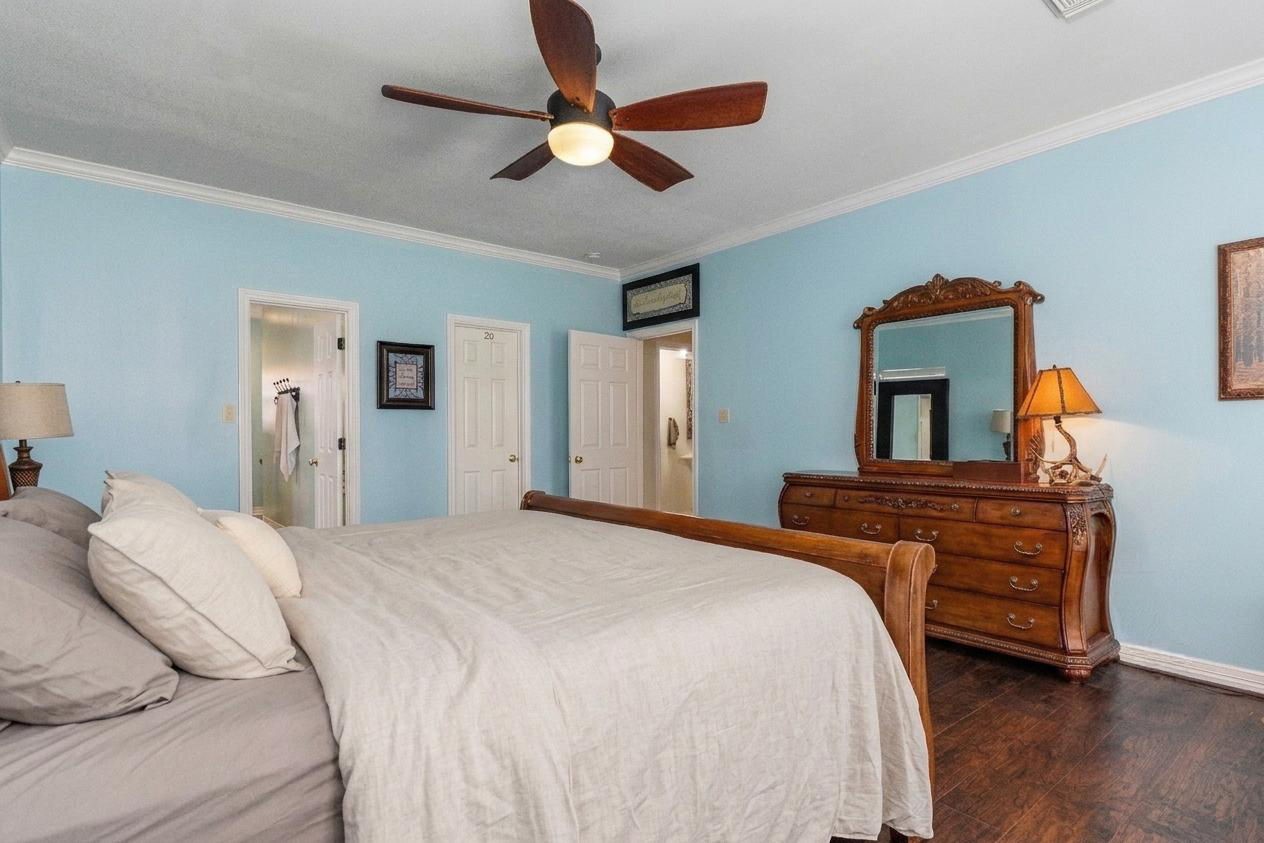 9139 Highway 94 Groveton, TX 75845 - Photo 29 of 49 a bedroom with a bed and a chandelier