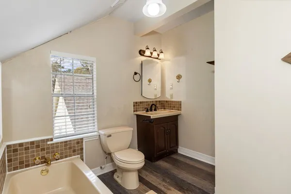 a view of a park with large trees