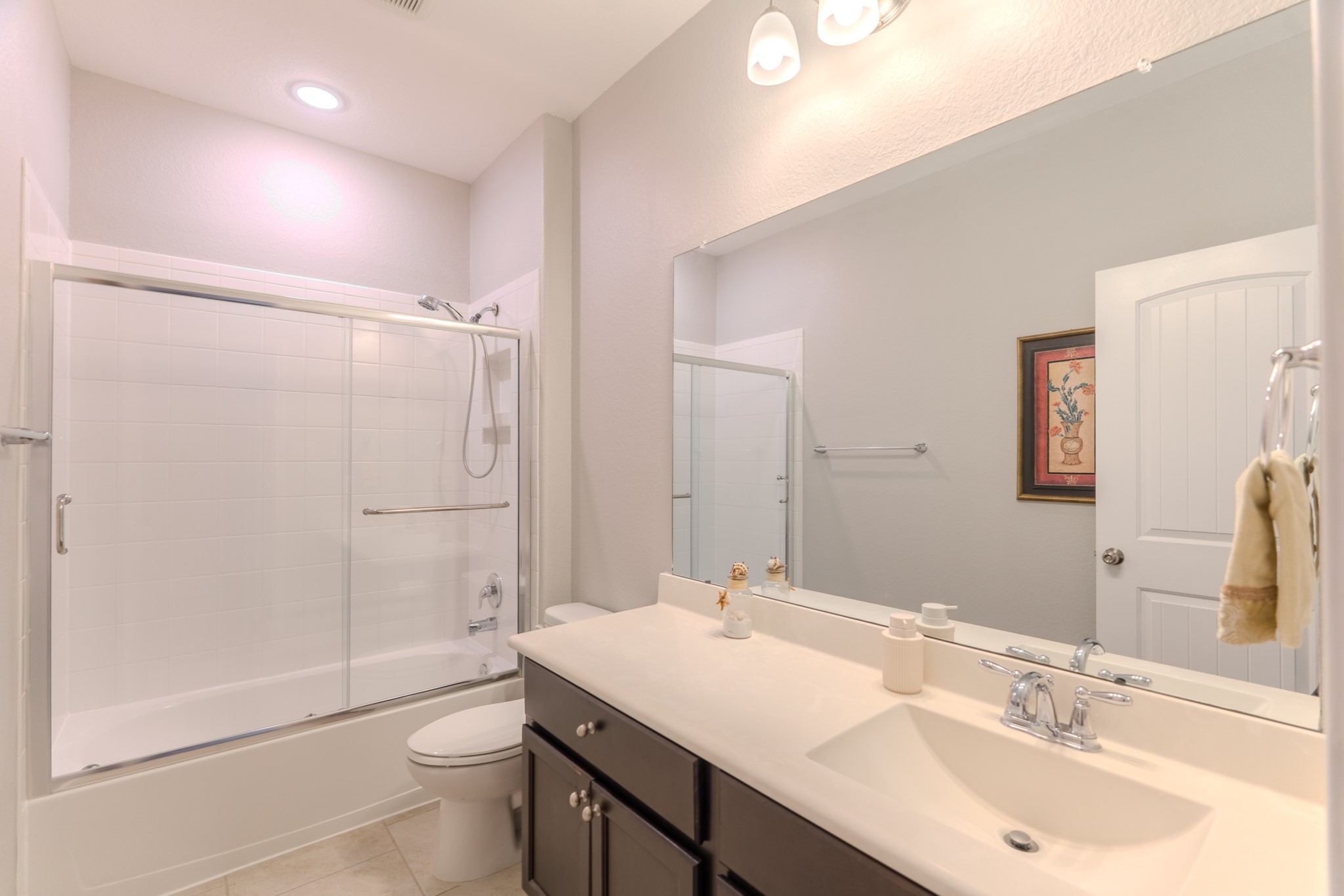 24322 North Newcastle Bay Trail Spring, TX 77389 - Photo 35 of 50 a bathroom with a sink toilet a mirror and shower