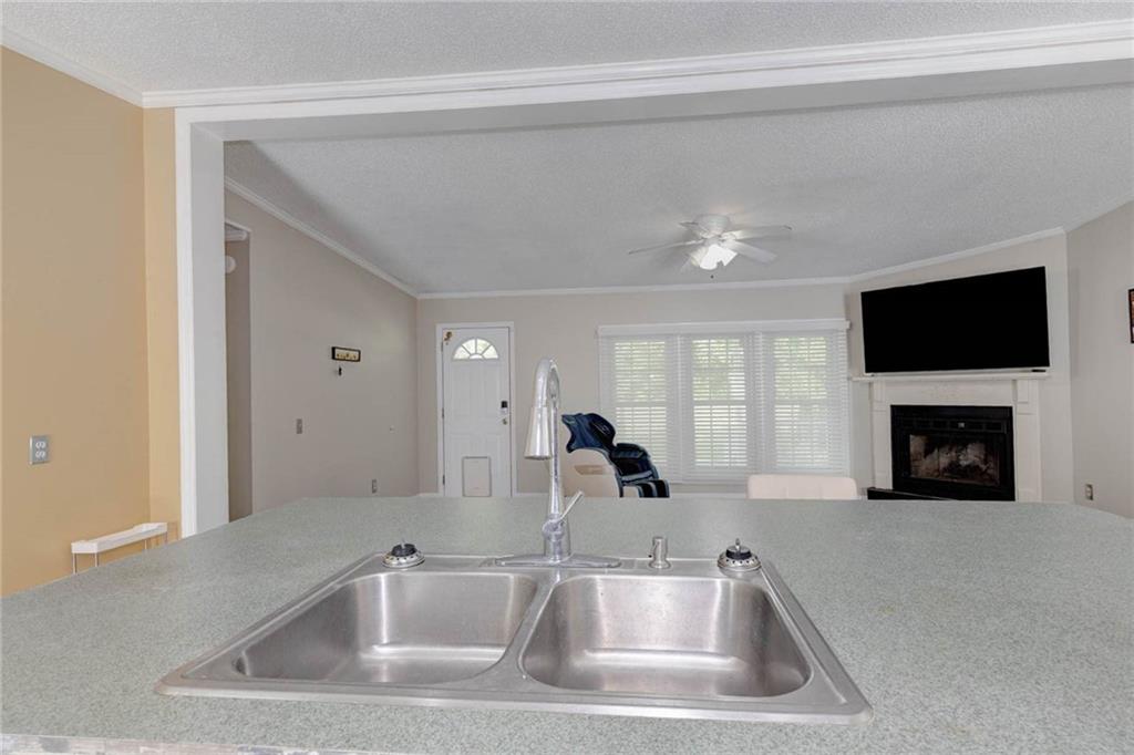 184 Floyd Road Pine Mountain, GA 31822 - Photo 22 of 27 Kitchen counter with an undermount dual-basin stainless steel sink and a gooseneck faucet