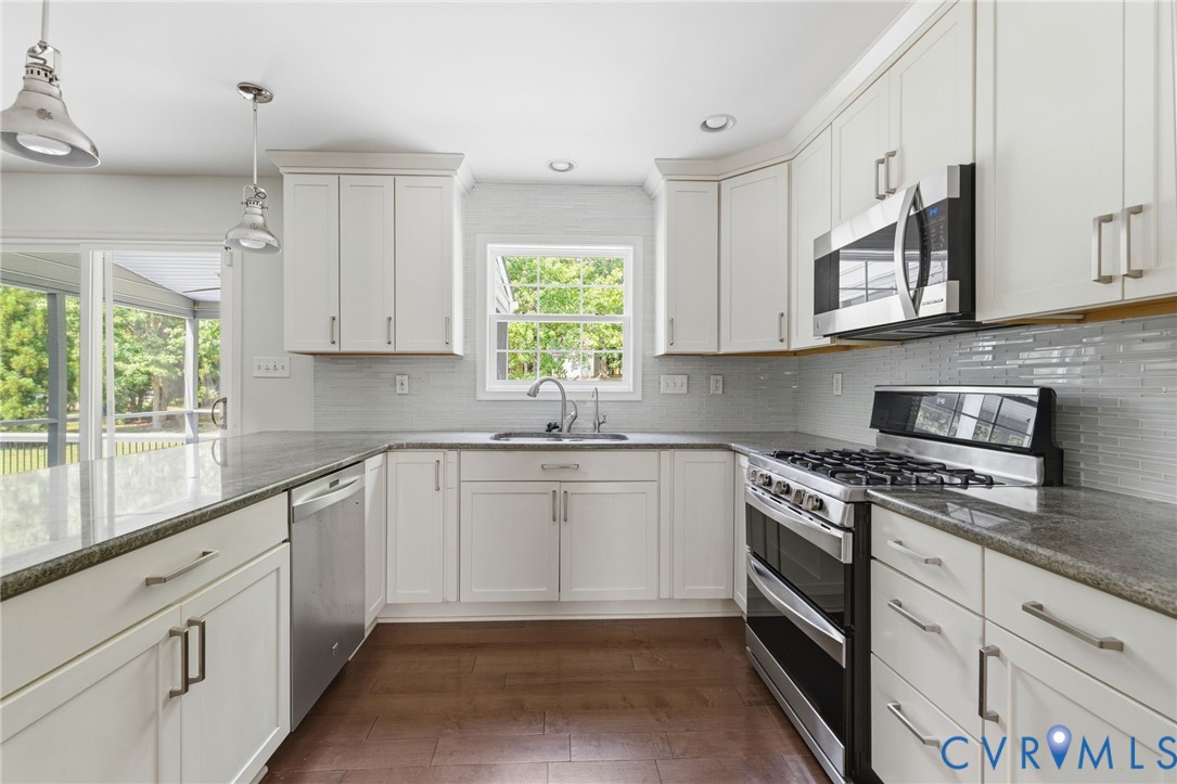 13524 Mountcastle Road Chesterfield, VA 23832 - Photo 13 of 44 U-shaped kitchen featuring white shaker cabinetry,