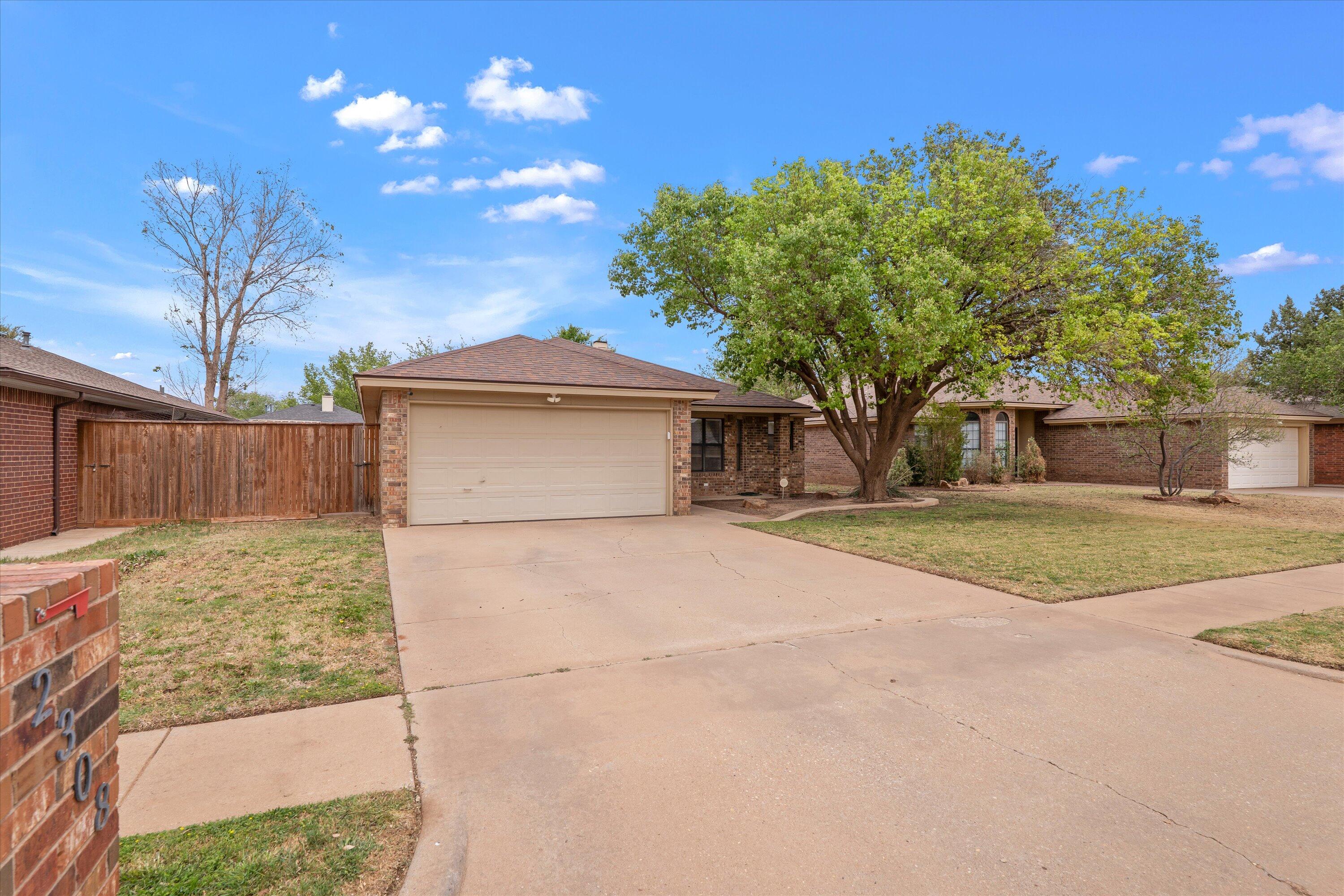 2308 93rd Street Lubbock, TX 79423 - Photo 2 of 28 a view of a house with a yard