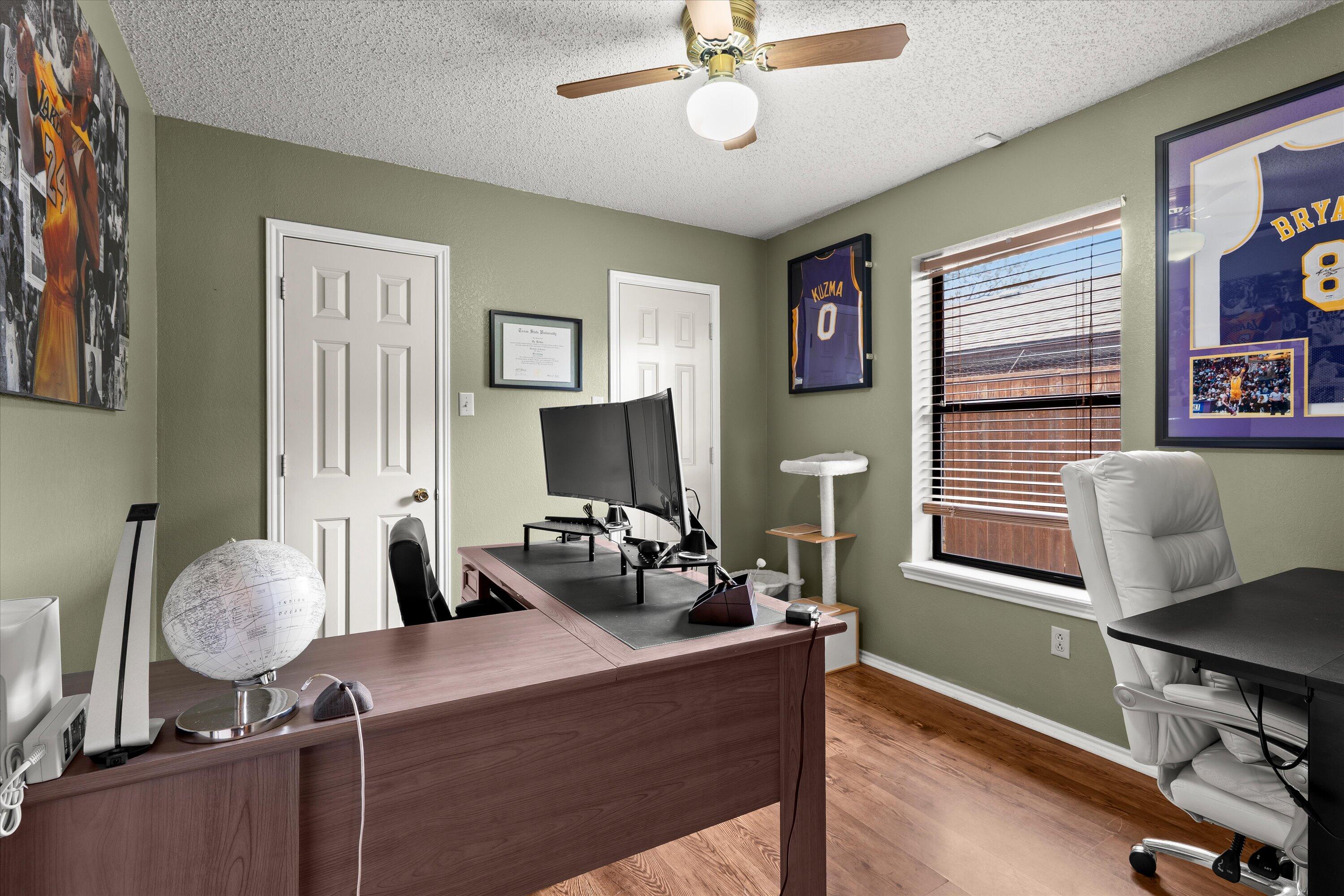 2308 93rd Street Lubbock, TX 79423 - Photo 21 of 28 a bedroom with furniture and a window