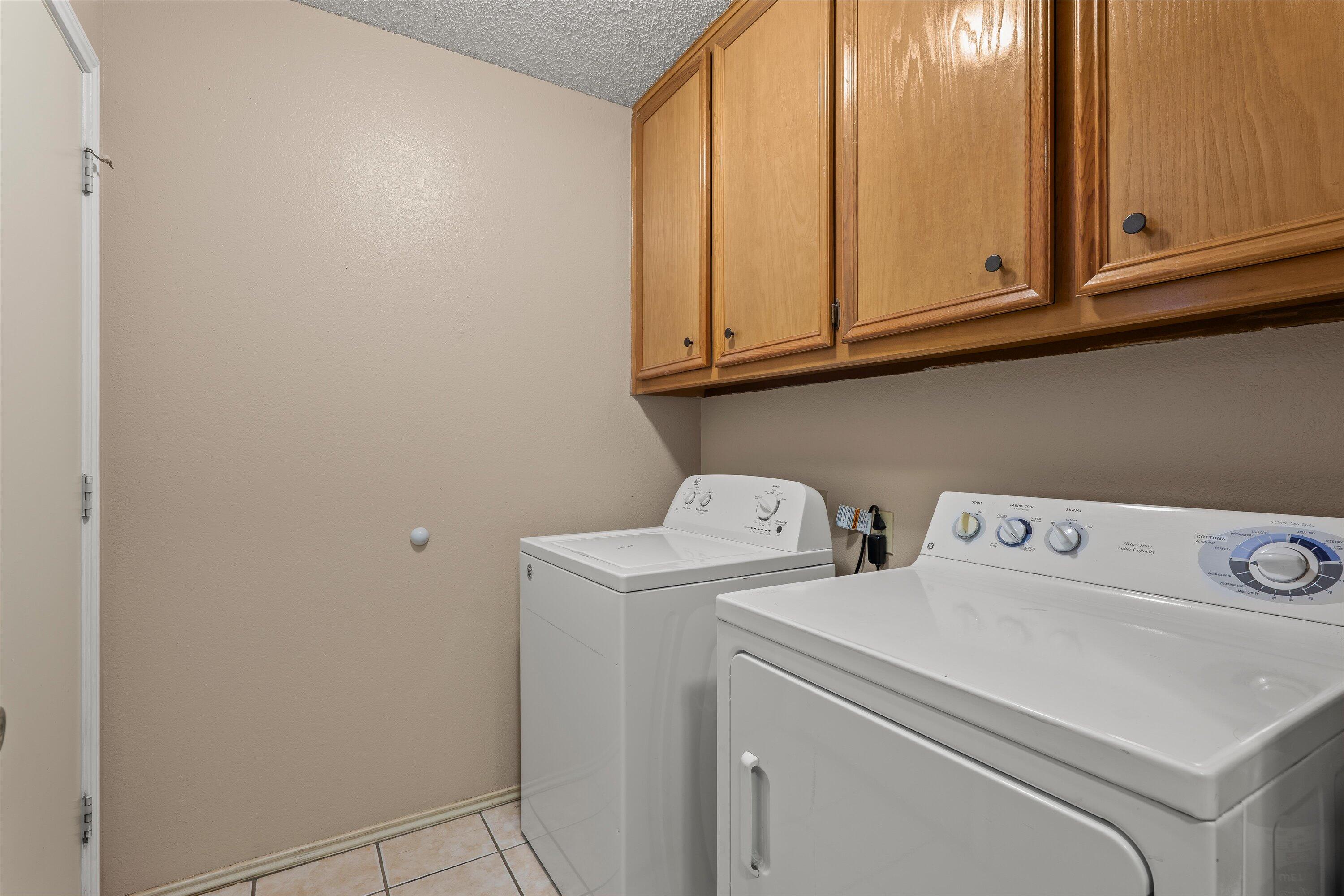 2308 93rd Street Lubbock, TX 79423 - Photo 22 of 28 a utility room with dryer and washer