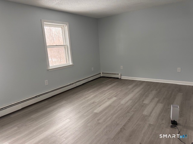 259 Westchester Road, Unit A Colchester, CT 06415 - Photo 13 of 22 an empty room with a window