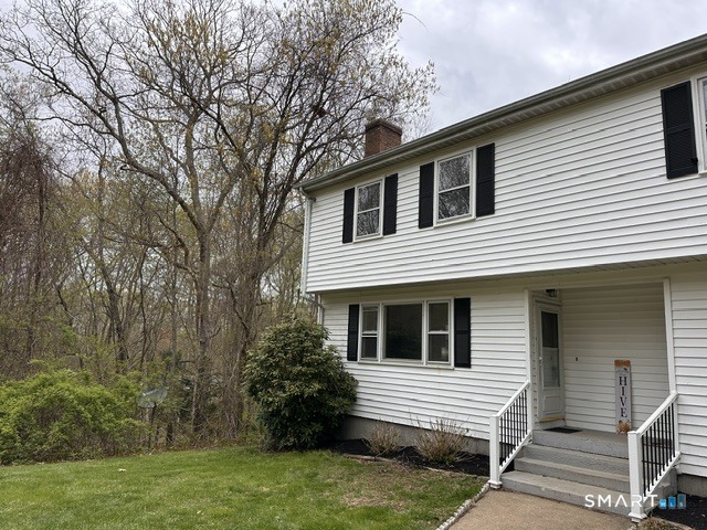 259 Westchester Road, Unit A Colchester, CT 06415 - Photo 2 of 22 a view of house that has a car park side of road