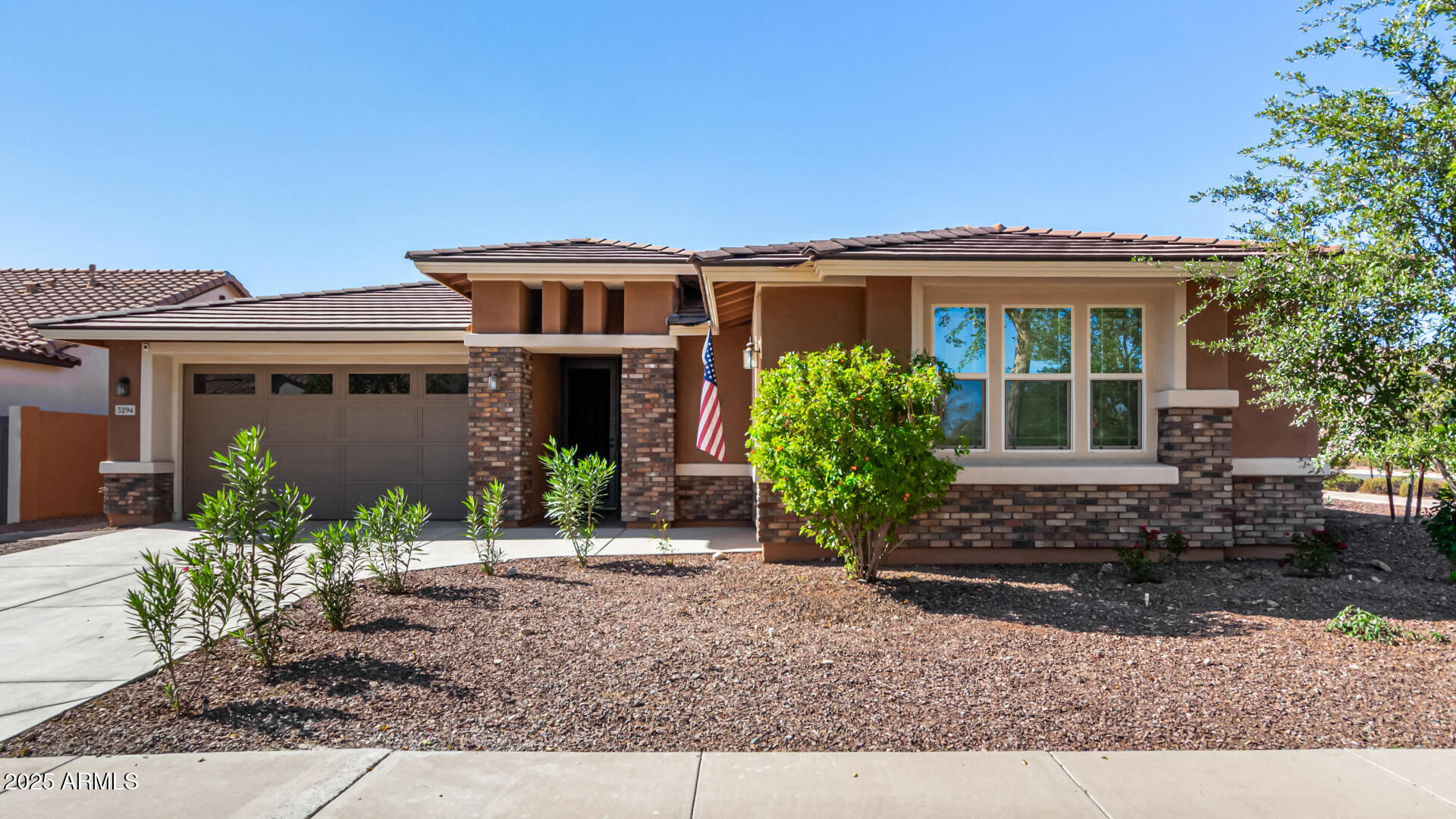 3294 North Springfield Street Buckeye, AZ 85396 - Photo 1 of 43 front view of a house with a porch