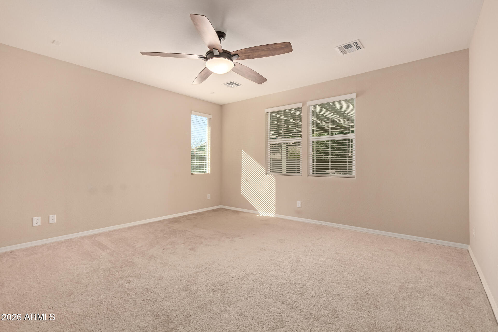 3294 North Springfield Street Buckeye, AZ 85396 - Photo 16 of 43 a view of an empty room with a window