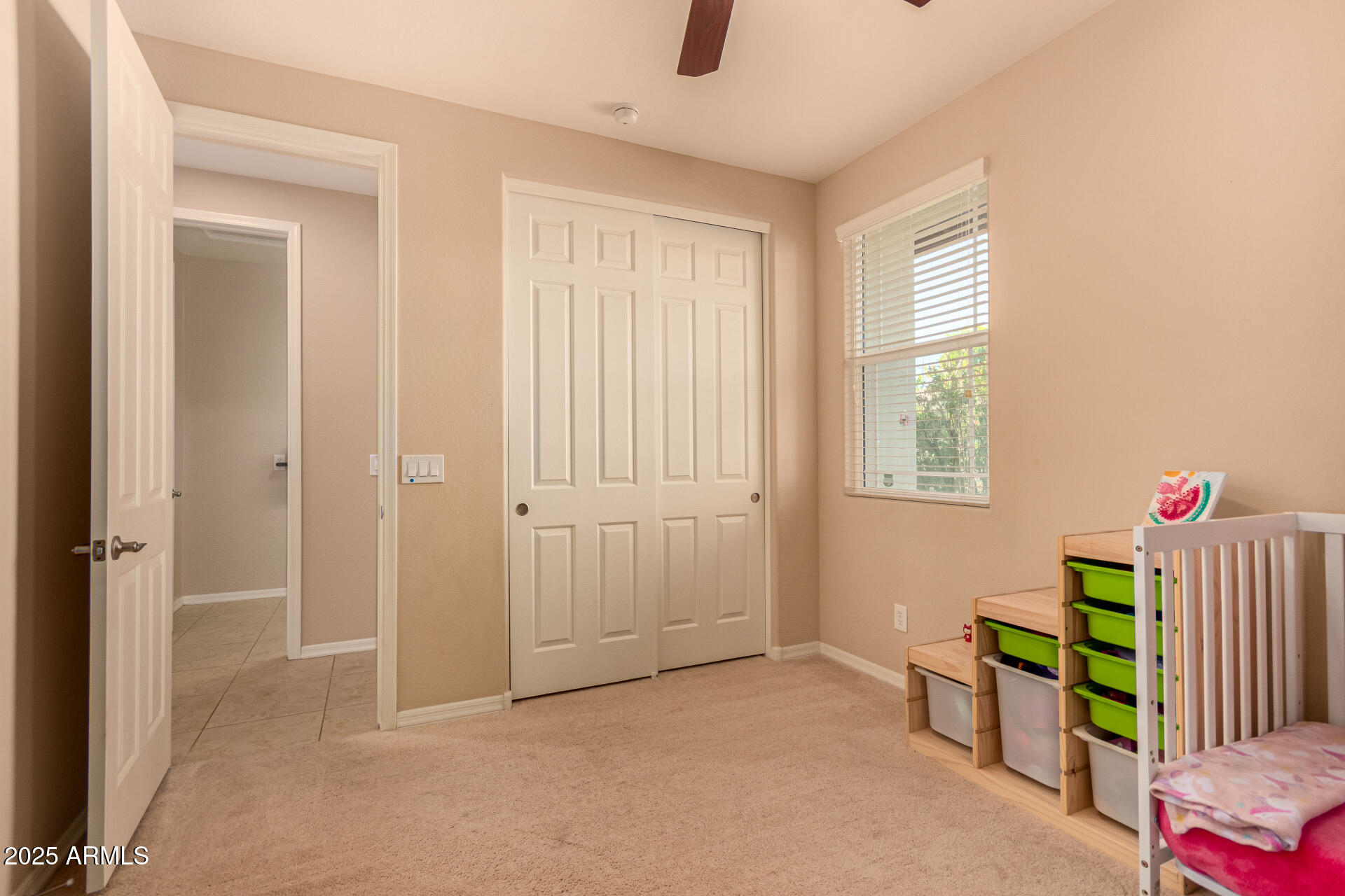 3294 North Springfield Street Buckeye, AZ 85396 - Photo 24 of 43 a view of an room with baby crib and windows