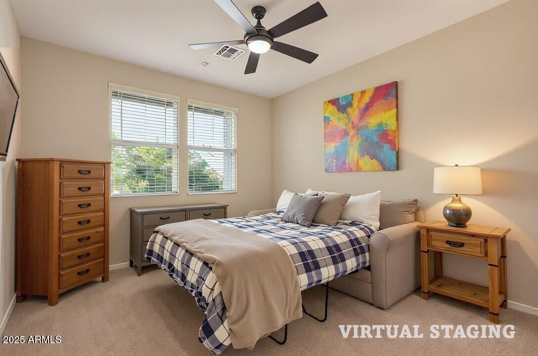 3294 North Springfield Street Buckeye, AZ 85396 - Photo 26 of 43 a bedroom with a bed and a painting on the wall