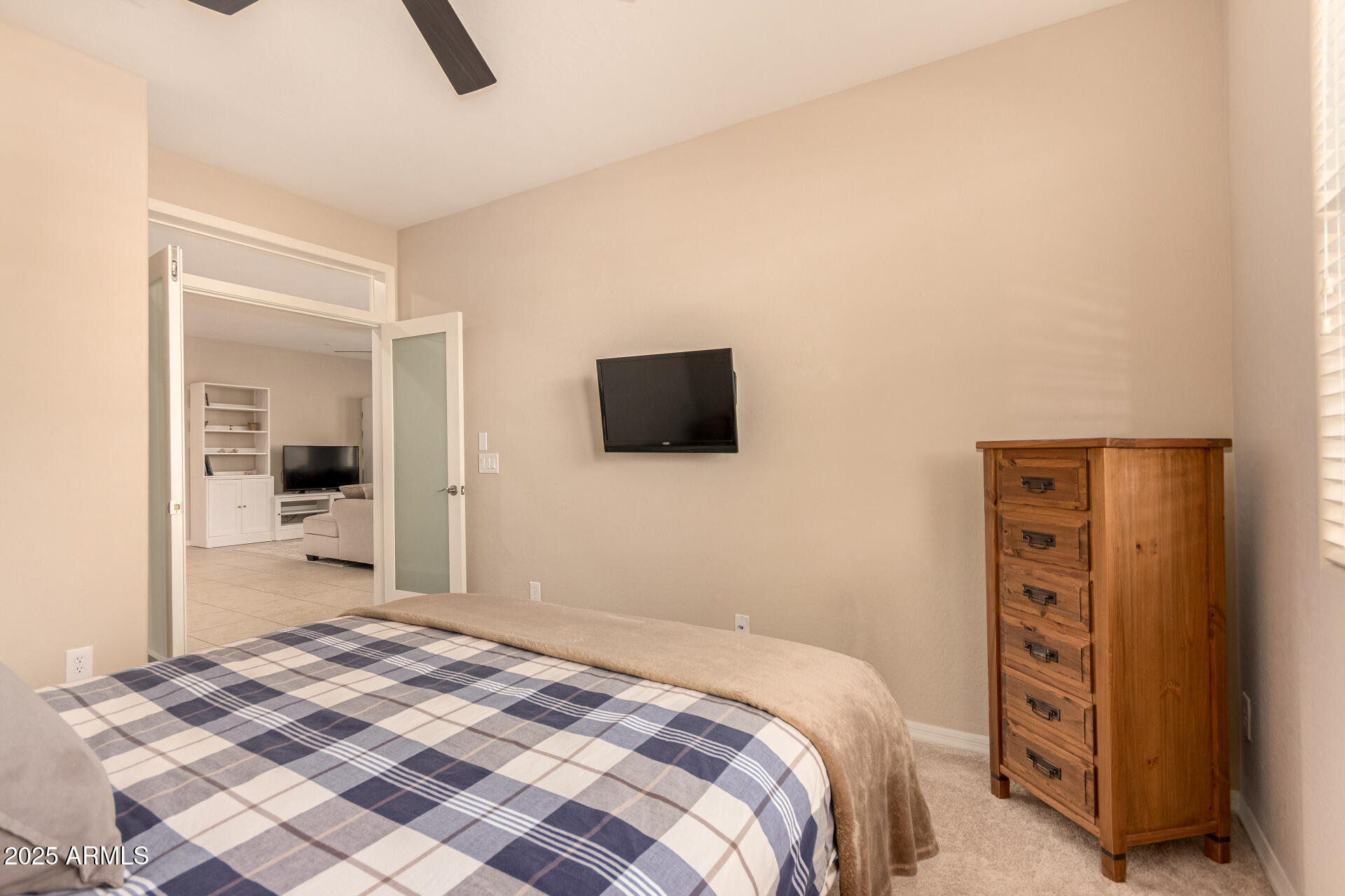 3294 North Springfield Street Buckeye, AZ 85396 - Photo 27 of 43 a bedroom with a bed and a television