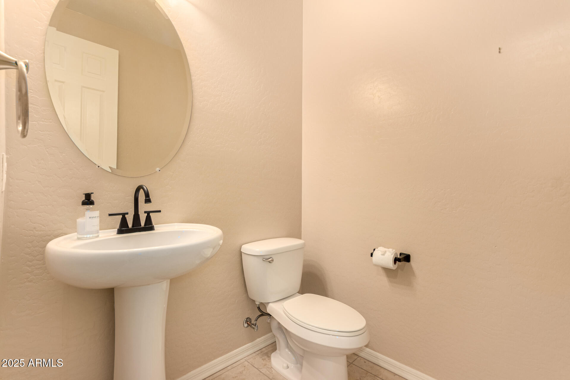 3294 North Springfield Street Buckeye, AZ 85396 - Photo 29 of 43 a bathroom with a sink a toilet and mirror