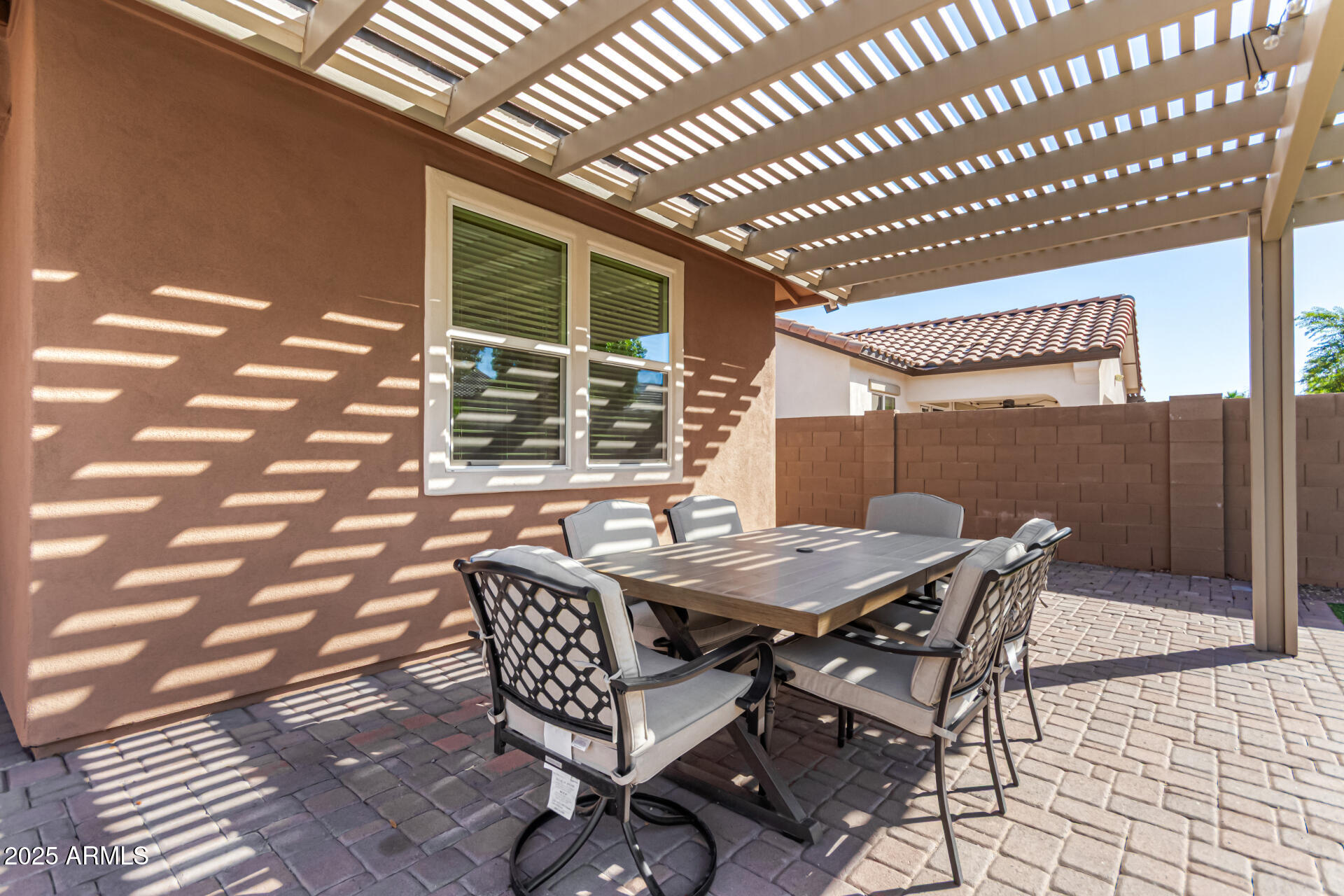 3294 North Springfield Street Buckeye, AZ 85396 - Photo 34 of 43 a patio with table and chairs