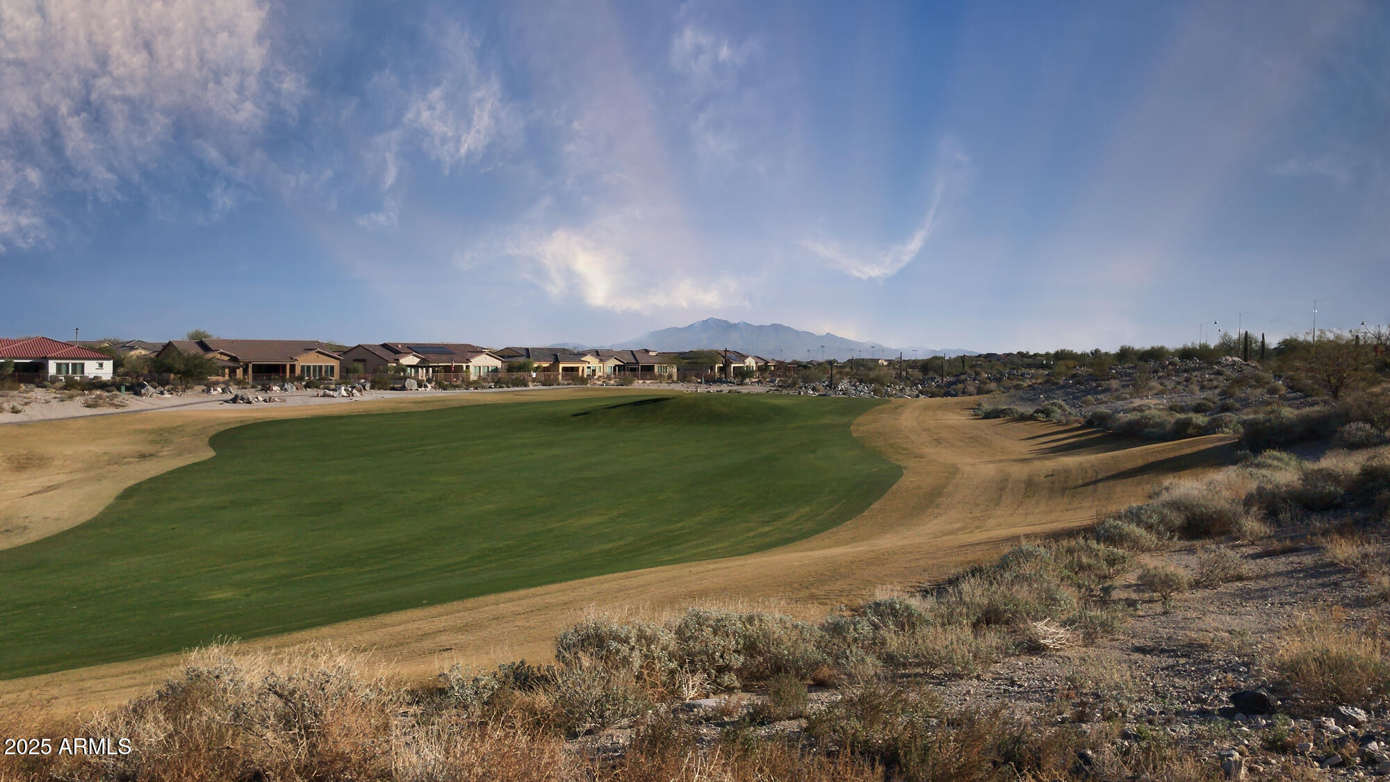 3294 North Springfield Street Buckeye, AZ 85396 - Photo 39 of 43 a view of a lake with houses in the back