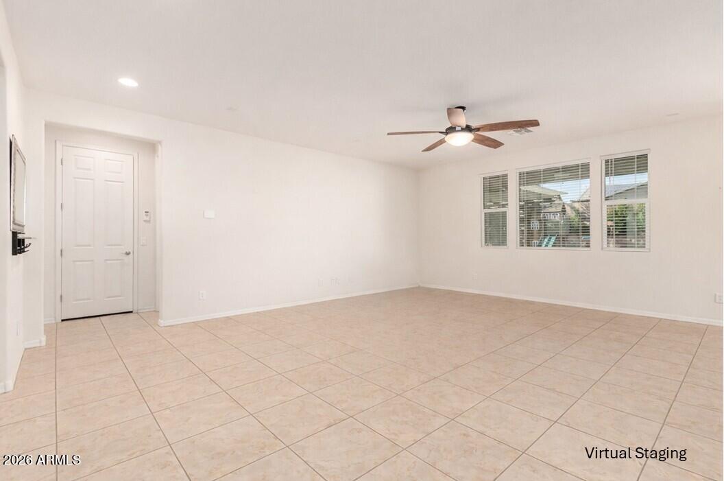 3294 North Springfield Street Buckeye, AZ 85396 - Photo 6 of 43 a view of an empty room with a window