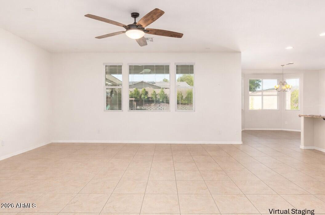 3294 North Springfield Street Buckeye, AZ 85396 - Photo 9 of 43 a view of an empty room with a window