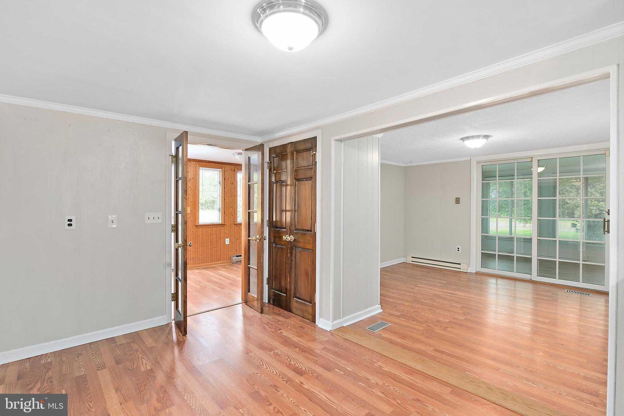 10826 Brownstone Road Princess Anne, MD 21853 - Photo 24 of 68 an empty room with wooden floor and windows