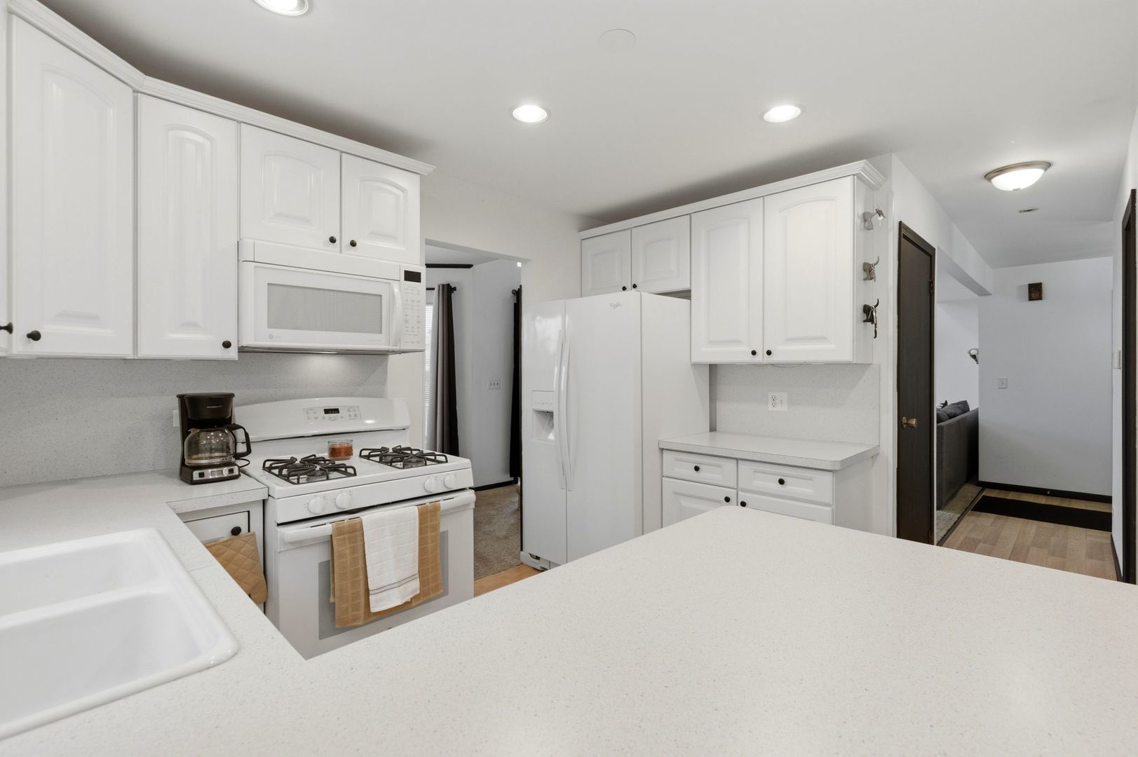 450 Ascot Lane Streamwood, IL 60107 - Photo 12 of 27 a kitchen with stainless steel appliances a refrigerator stove and white cabinets