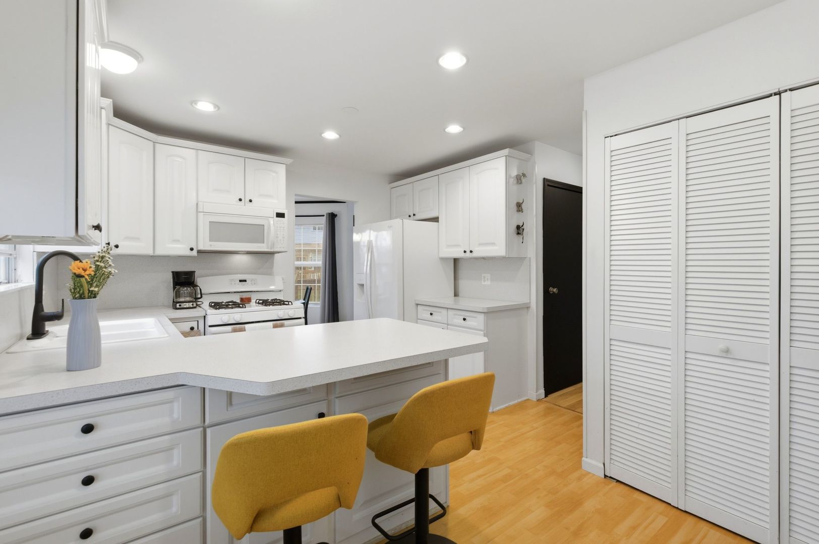 450 Ascot Lane Streamwood, IL 60107 - Photo 13 of 27 a kitchen with stainless steel appliances a refrigerator sink and cabinets