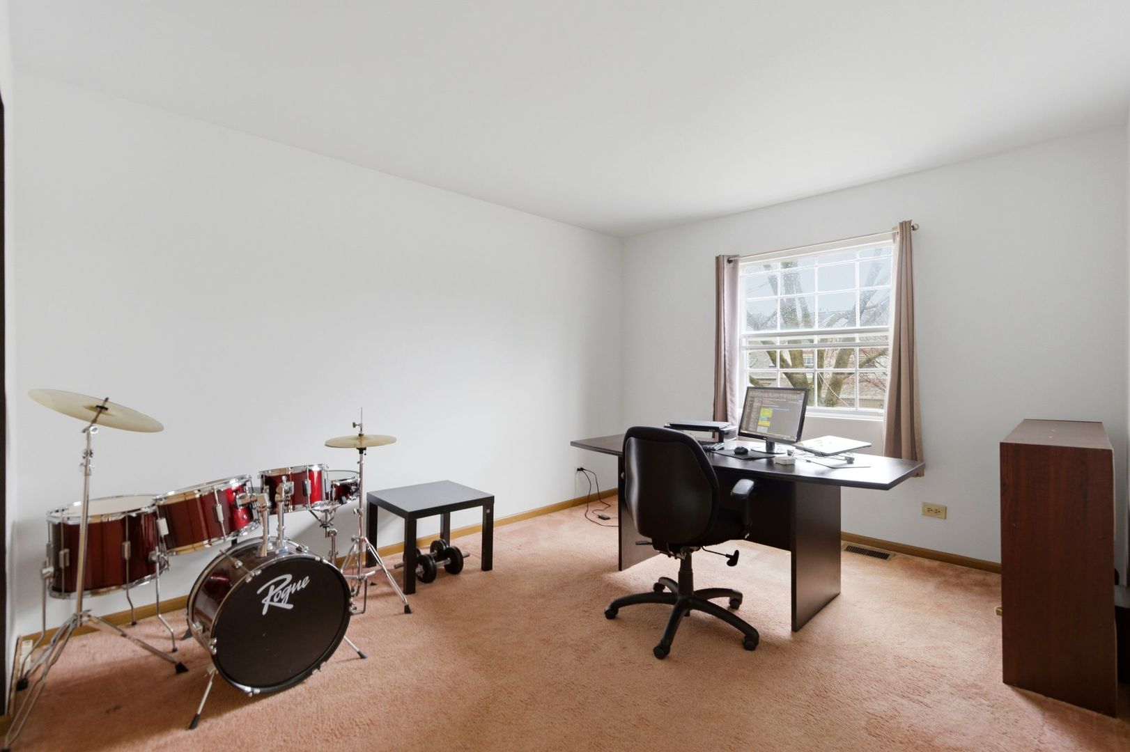 450 Ascot Lane Streamwood, IL 60107 - Photo 15 of 27 a view of a workspace with furniture and a window