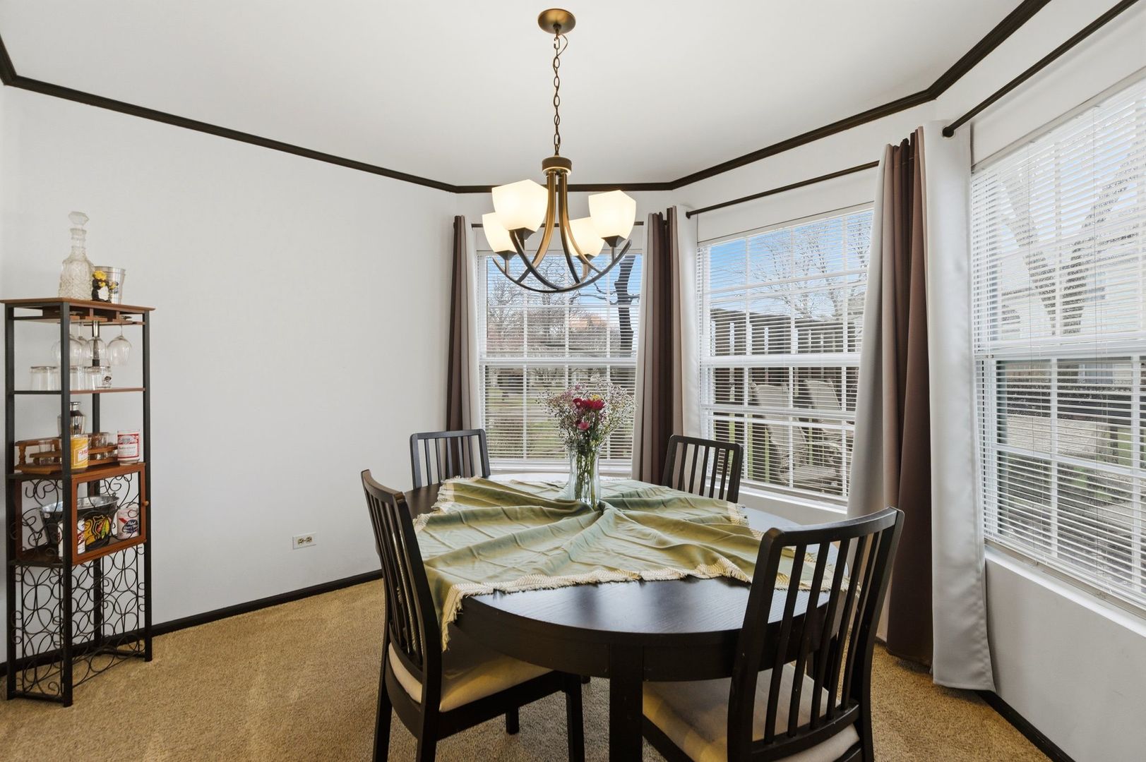 450 Ascot Lane Streamwood, IL 60107 - Photo 16 of 27 a view of a dining room with furniture window and outside view