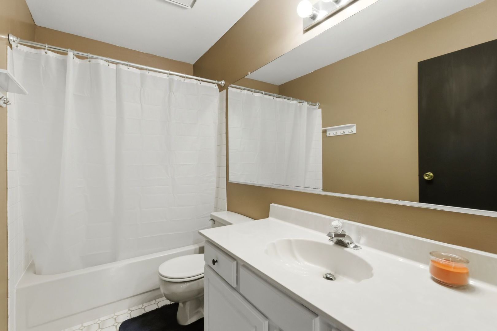 450 Ascot Lane Streamwood, IL 60107 - Photo 22 of 27 a bathroom with a sink a toilet and shower