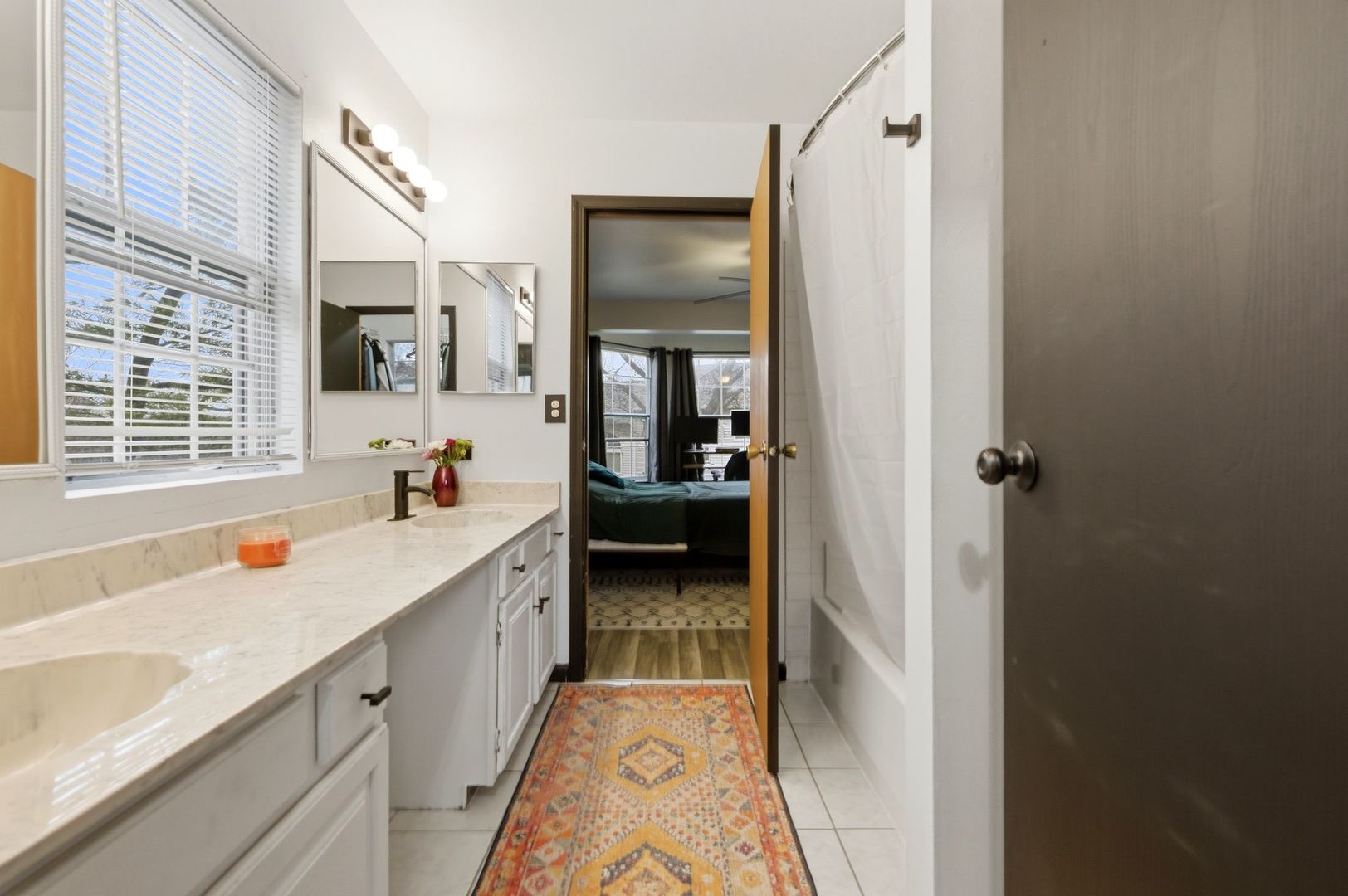450 Ascot Lane Streamwood, IL 60107 - Photo 23 of 27 a bathroom with a granite countertop tub sink and mirror