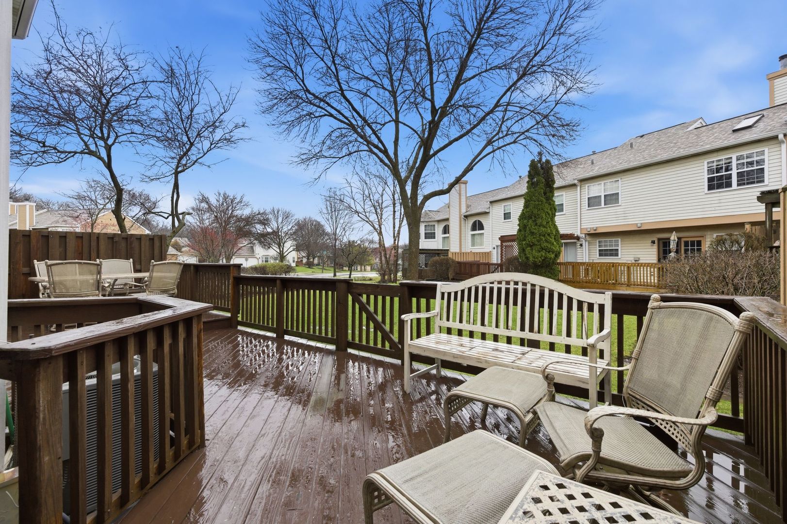 450 Ascot Lane Streamwood, IL 60107 - Photo 25 of 27 a view of a roof deck with wooden fence and wooden floor