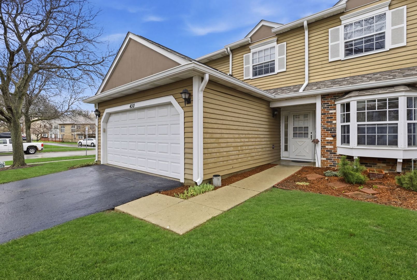450 Ascot Lane Streamwood, IL 60107 - Photo 4 of 27 a view of a backyard with a garden and entertaining space