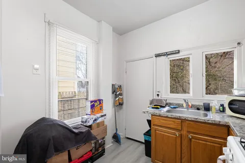 a view of an entryway with wooden floor